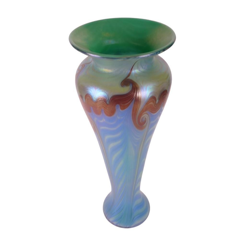 Presenting this lovely, Vandermark - Merritt art glass vase. Vase is decorated with a combed & hooked feather design. The main color of this vase is an iridescent pastel green at the shoulder and pastel blue on the body with iridescent bronze pulled