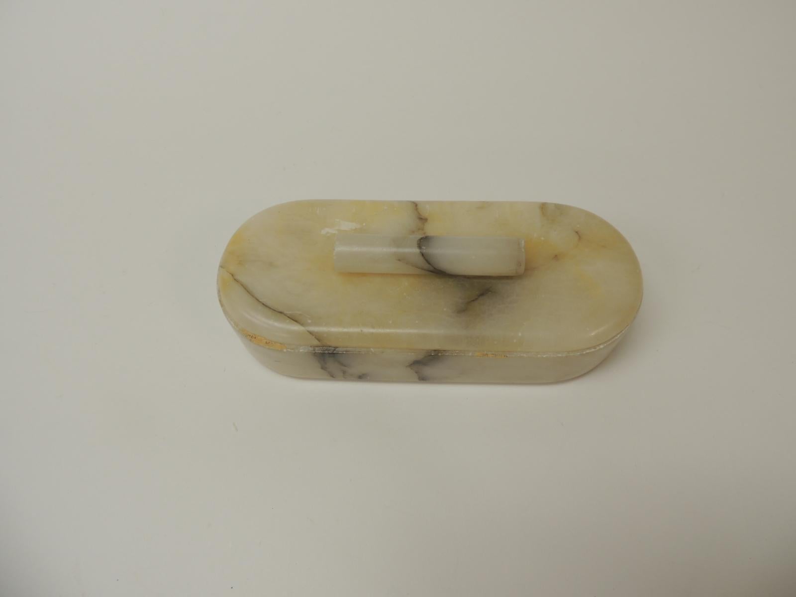 Vintage vanity handcrafted Alabaster Art Deco oval box
Oval hand-crafted natural alabaster color with lid and round handle. Alabaster box perfect for a vanity table.
Size: 9” W x 4” D x 3” H.

 
