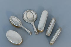 Vintage Vanity Set of 5 Brushes and a Mirror in Silver