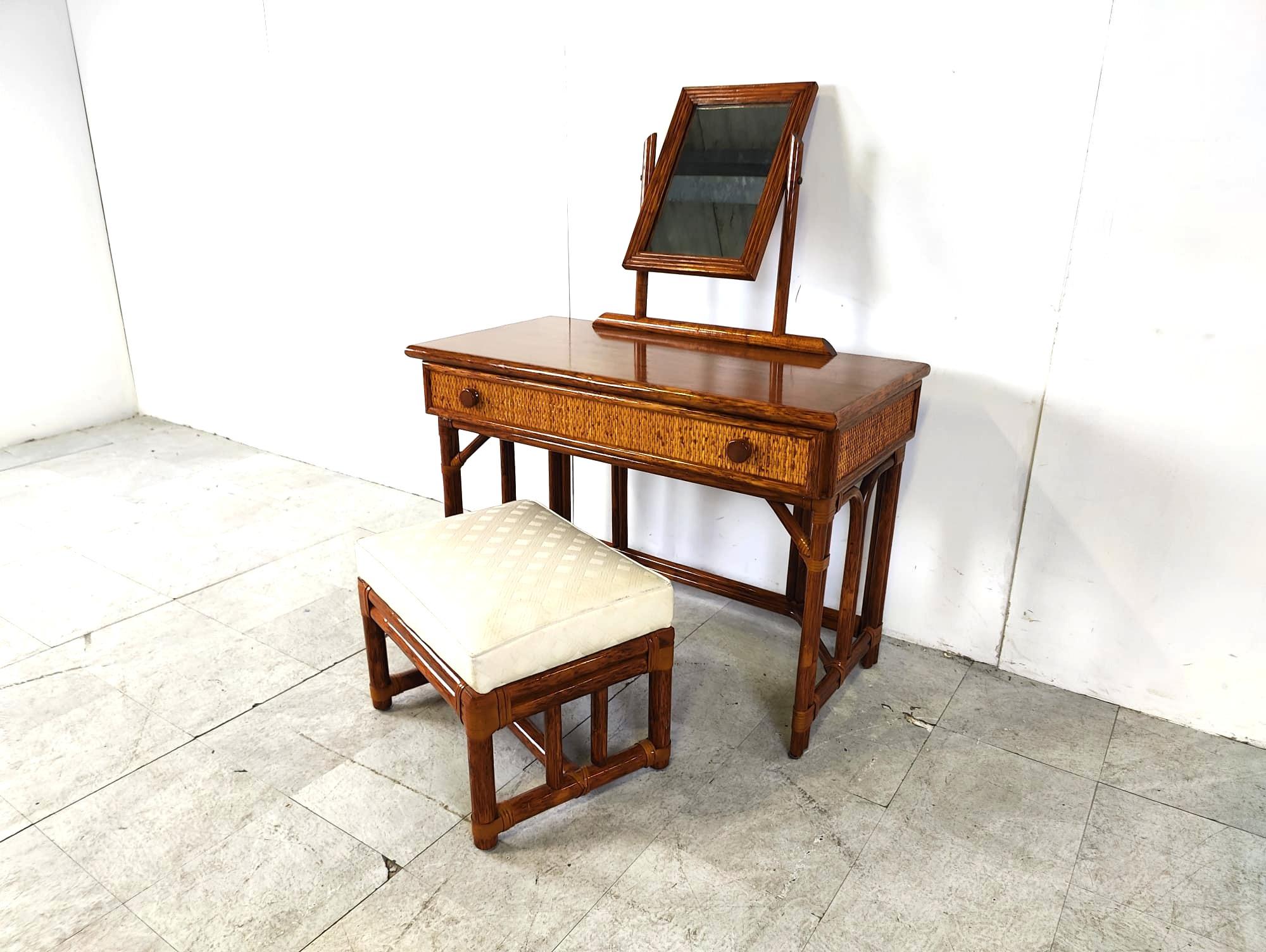 Vintage vanity table by Maugrion made from bamboo and rattan with a mirror and large drawer.

Comes with stool

High quality and elegant vintage furniture piece which will add a touch of charm to your bedroom.

1970s - France

Very good
