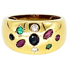 Anello vintage di varie forme con rubino, zaffiro, smeraldo e diamante a cupola in oro 18 carati