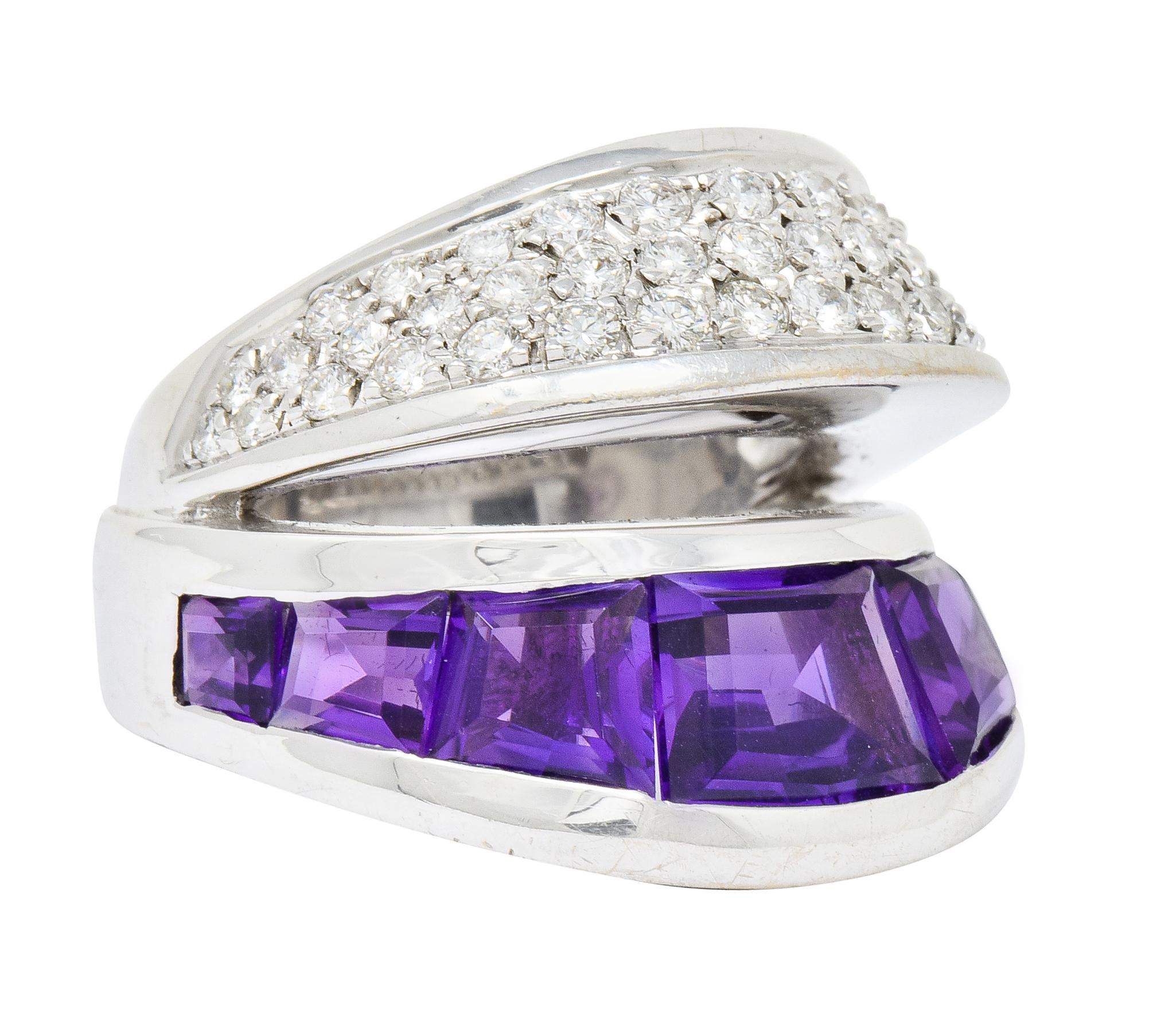 Split band ring comprised of two dynamically angled segments

One segment is channel set with rectangular calibré cut amethyst; a very well-matched deep purple color

Second segment is pavé set with round brilliant cut diamonds weighing