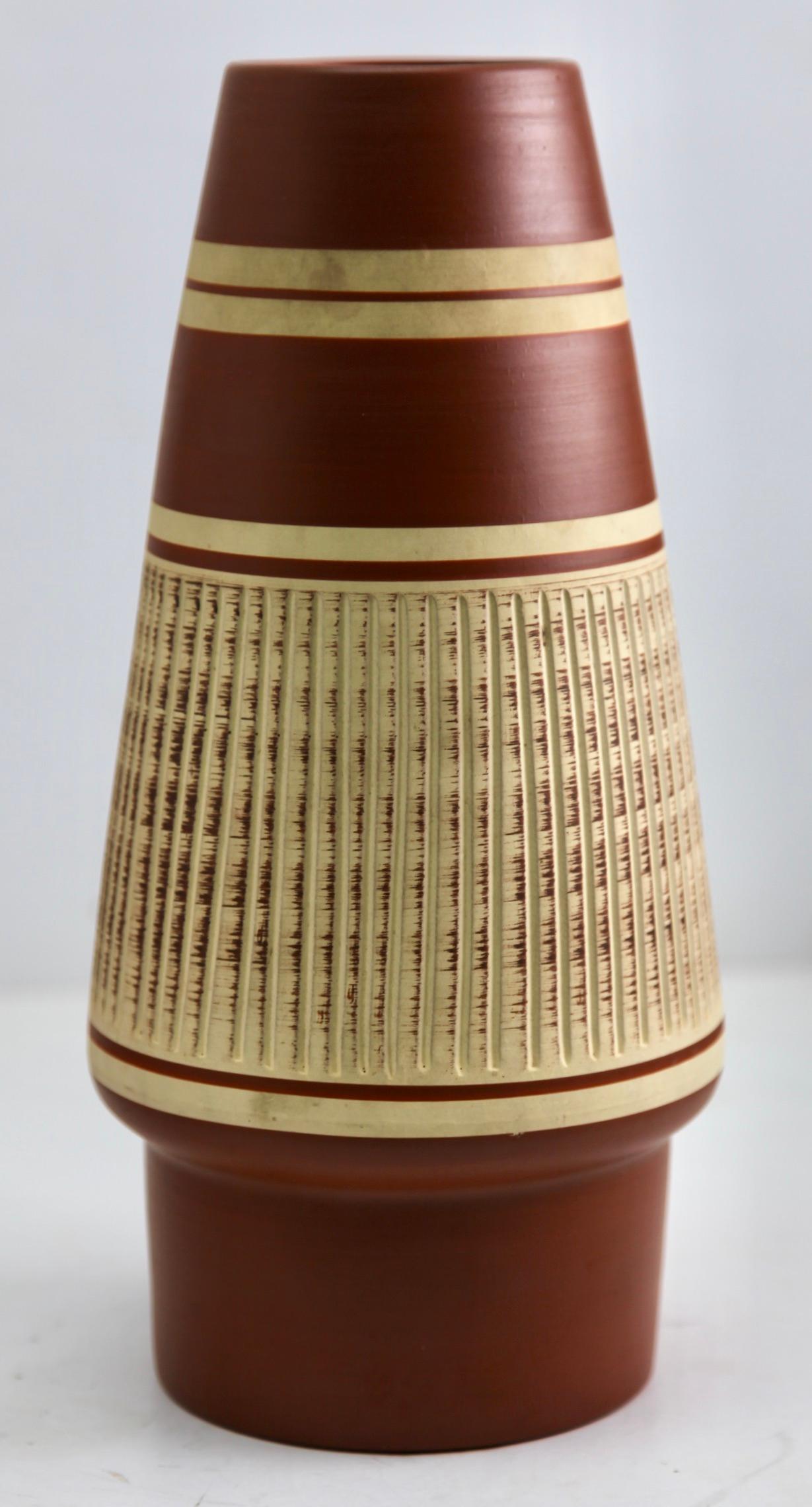 These original vintage vase was produced in the 1970s in Germany. It is made of ceramic pottery.
The bottom are marked the vase series number 353-30
Straightforward and minimalistic design of the 1960s design era. 
Super rare in this coloration.