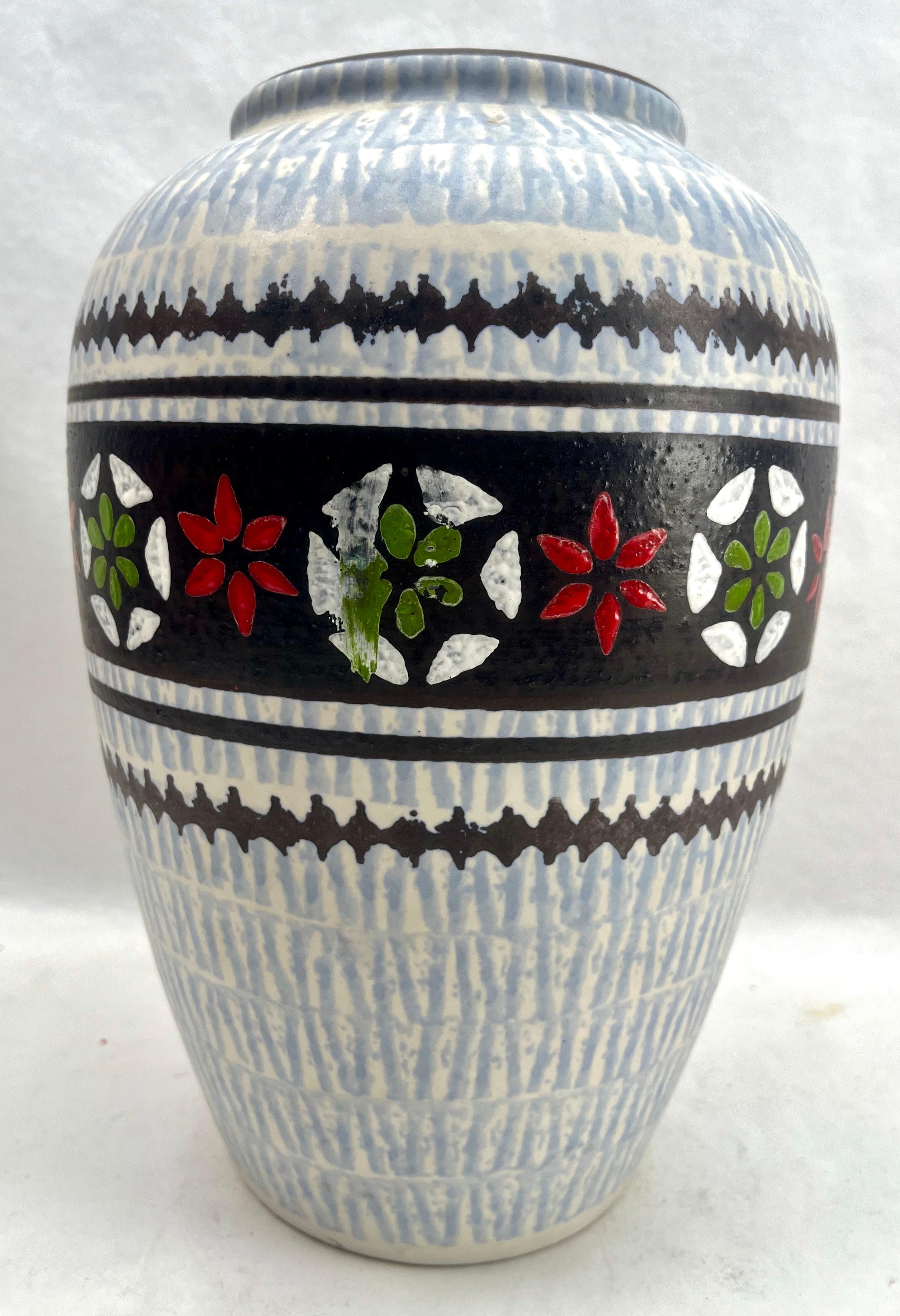 These original vintage Jasba vase was produced in the 1970s in Germany. It is made of ceramic pottery.
The bottom are marked the vase series number 136-26 Handarbeit.
Straight forward and minimalistic design of the 1960s design era. 
Super rare in