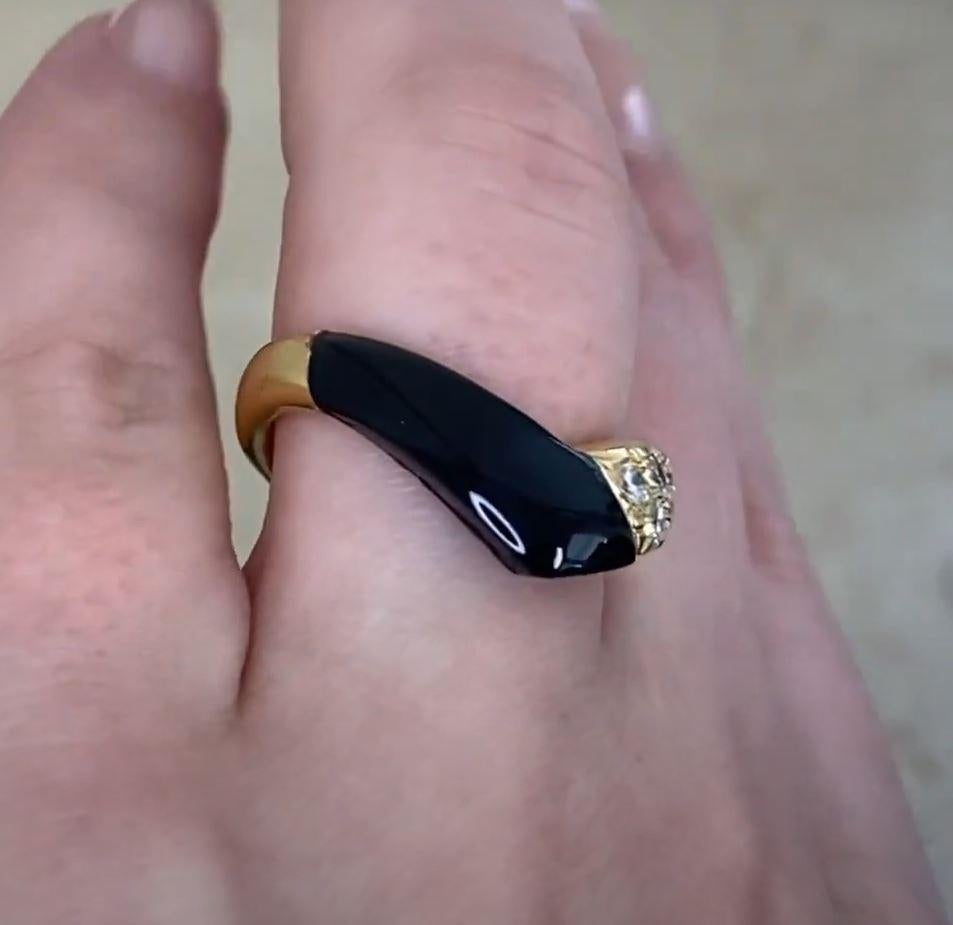 This exquisite vintage Van Cleef & Arpels ring showcases a striking V-shaped design, seamlessly blending timeless elegance with bold contrast. One section of the ring is adorned with rich, polished onyx, while the other is encrusted with pave-set