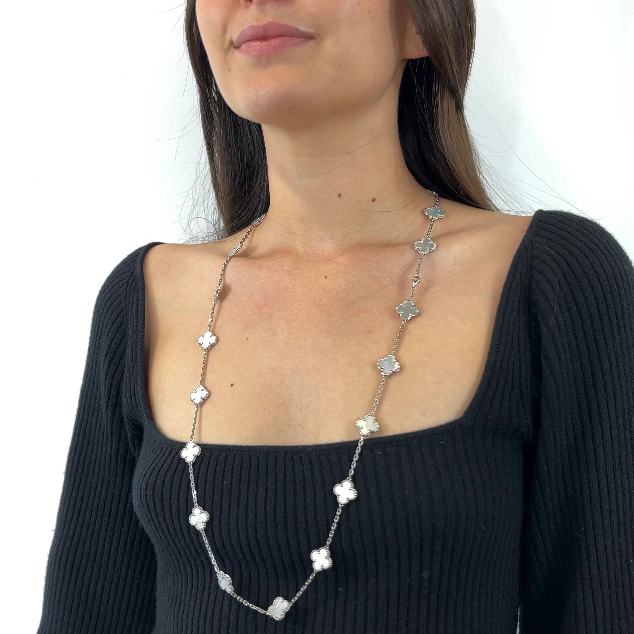 One Vintage VCA 33 Inch Mother of Pearl 18 Karat White Gold Alhambra Necklace. Featuring numerous polished mother of pearl clovers. Crafted in 18 karat white gold, signed VCA, serial #JB304529. Circa 2010s. The necklace is 33 inches in length.