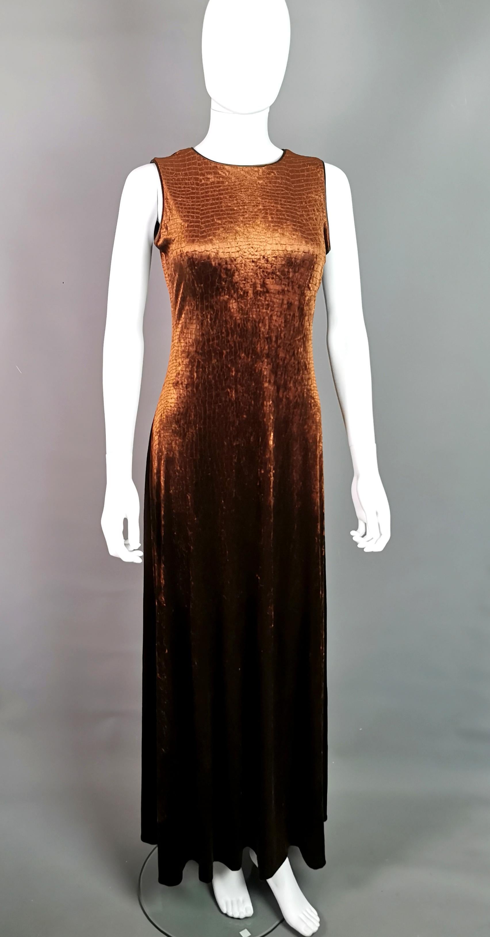 A rare vintage c1990s Huey Waltzer for Neiman Marcus maxi dress.

It is a soft synthetic velvet in a mock Croc print in a rich choclate brown colour.

It is a maxi dress and very figure hugging with a fair amount of stretch.

It is sleeveless and