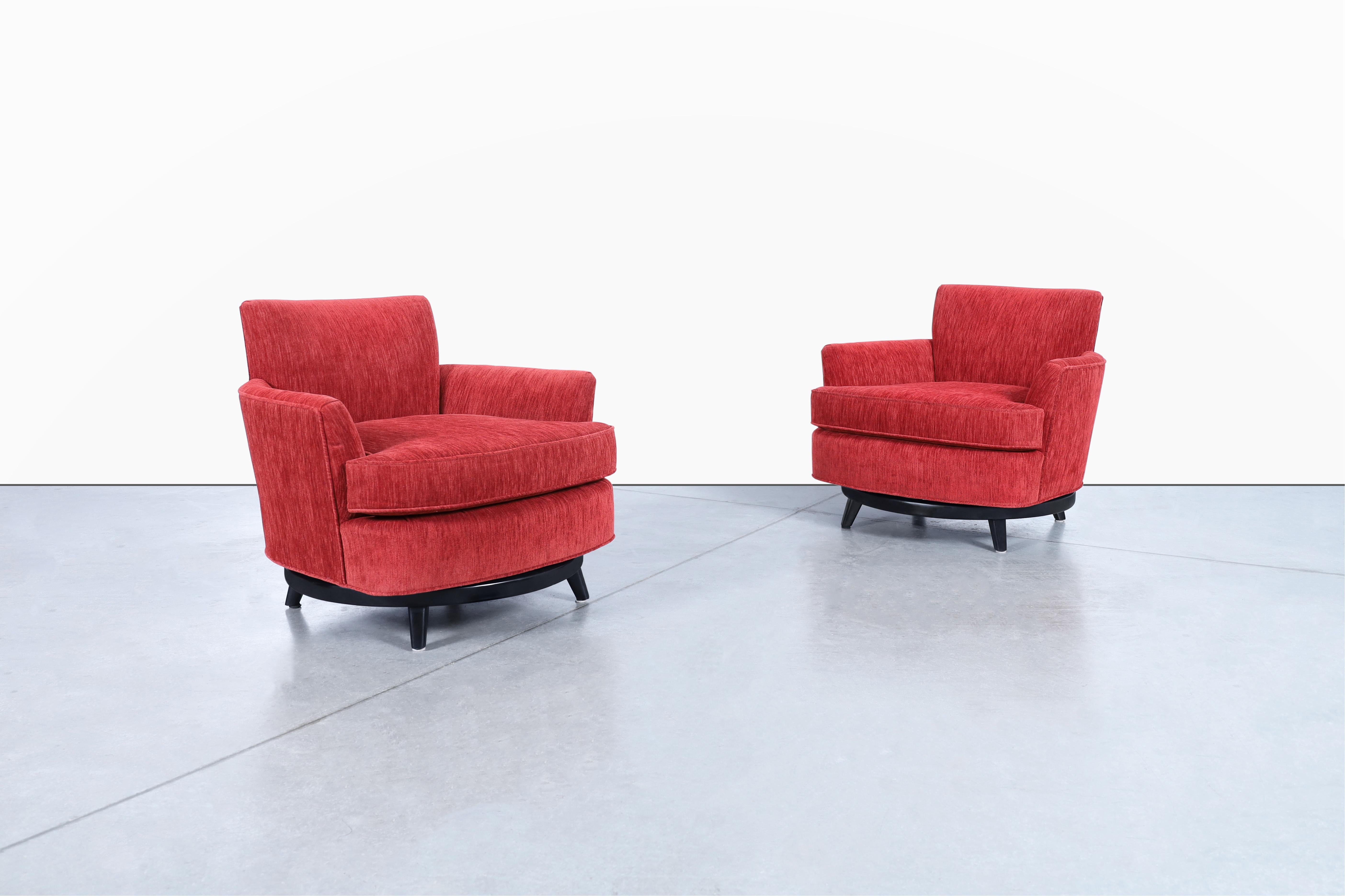 Beautiful vintage velvet “barrel” swivel lounge chairs in style of Monteverdi Young, circa 1950s. This pair of chairs is a true representation of vintage style, designed with a unique barrel shade design that is professionally reupholstered in a