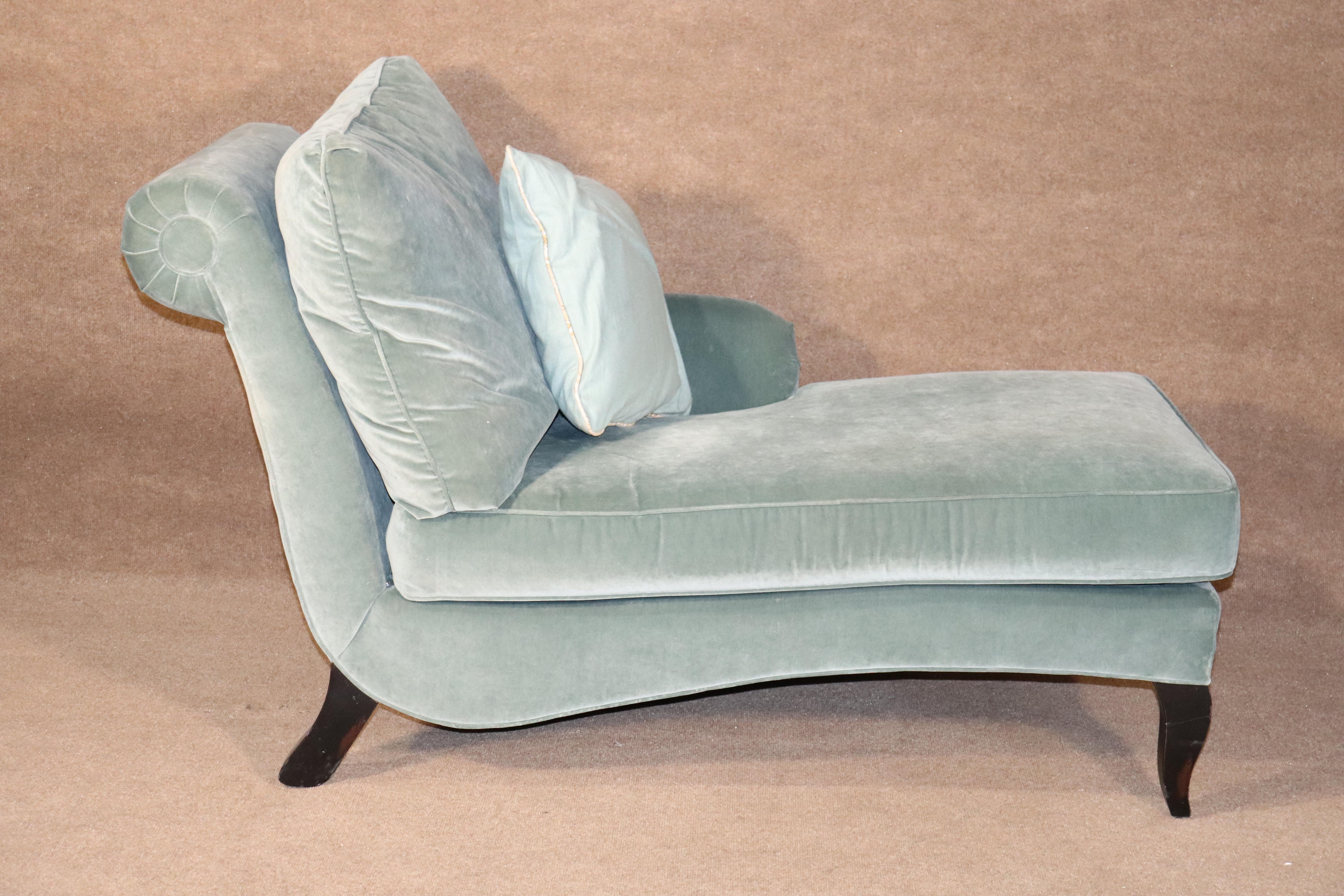 Vintage fainting couch in rich velvet. Features rolling arm on one side and wood legs. Light aqua blue coloring.
Please confirm location.