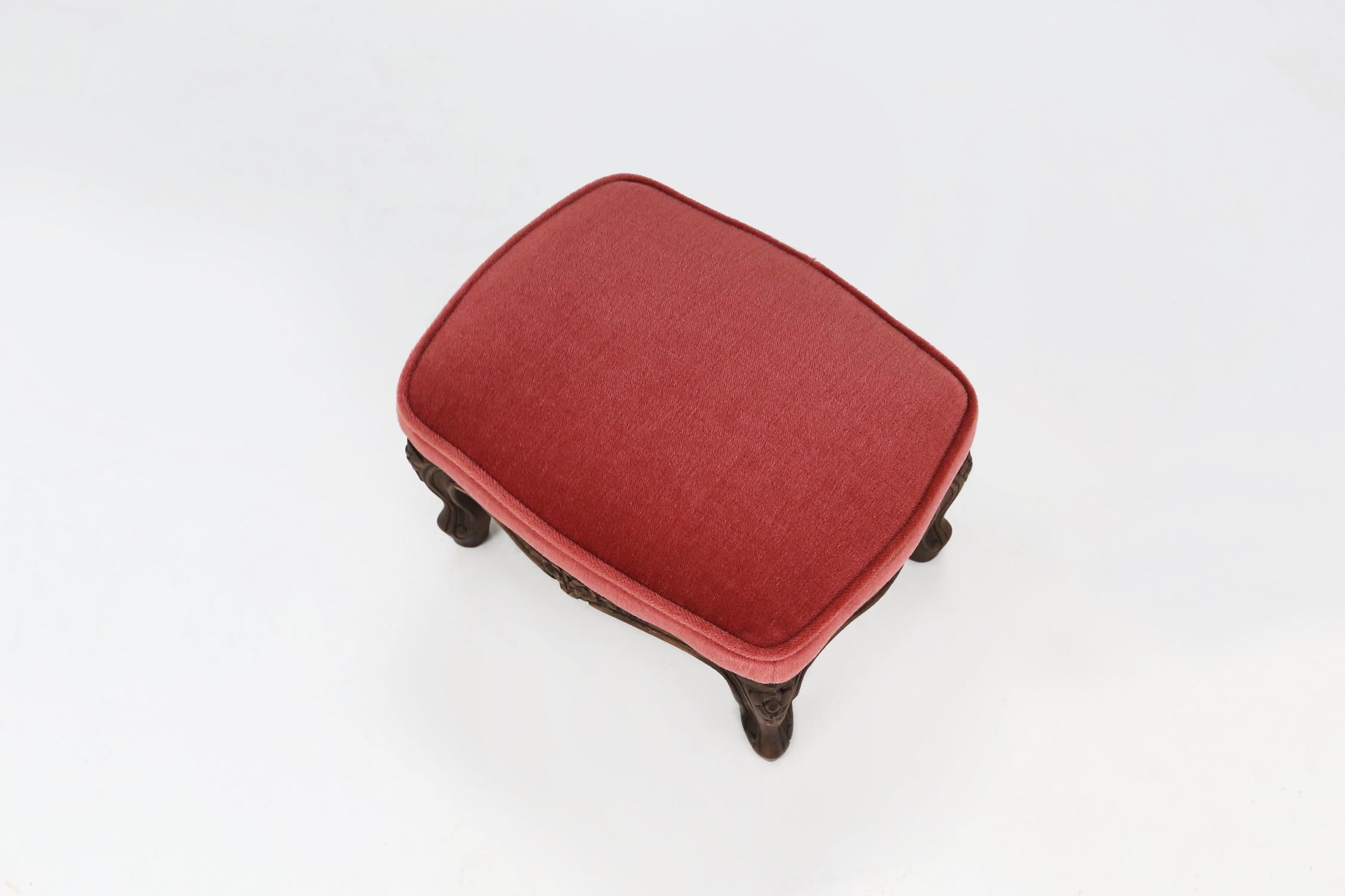 Vintage velvet stool made around 1950 in red/pink velvet fabric.