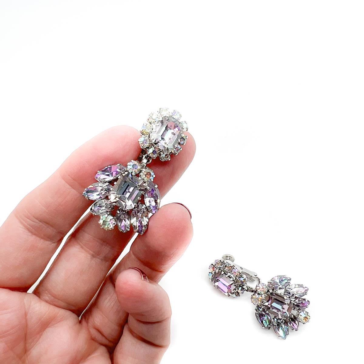 A divine Pair of Vintage Vendome Crystal Earrings. A sublime find, featuring claw set fancy cut crystals in a myriad of shapes including emerald cuts and marquise. The stone colouring a most delicate and captivating lilac and purple toned aurora