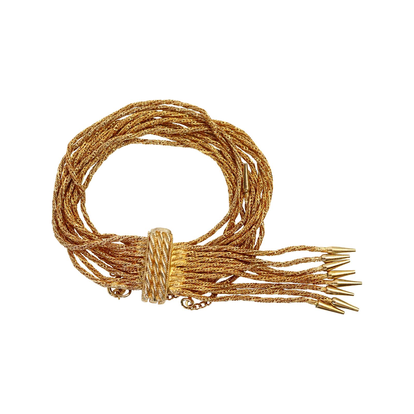 Vintage Vendome Gold 10 link Bracelet with Dangling Pieces Circa 1960s. Ce bracelet s'enroule autour d'un  fermoir rigide qui s'enroule pour se fermer et  est composée de rangées de chaînes pendantes avec, à leur extrémité, des capuchons munis de