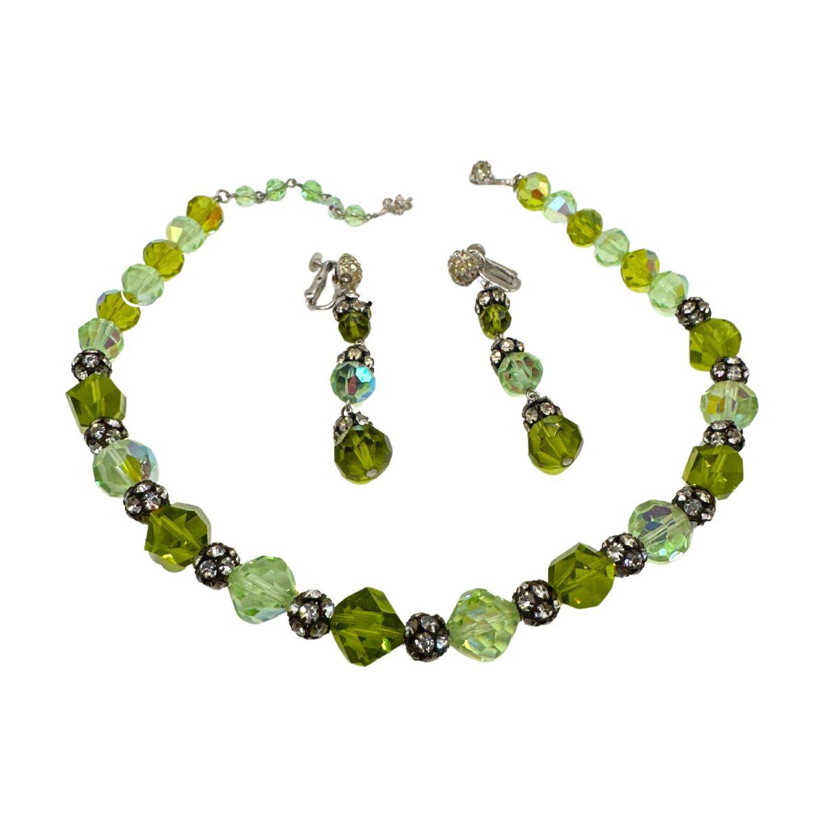 Bracelet Length: 17″

Bin Code:  N1 / P4

Step into the world of vintage glamour with our Vintage Vendome Green Glass & Rhinestone Necklace Set. This exquisite set features a stunning necklace and a pair of matching earrings, crafted with meticulous