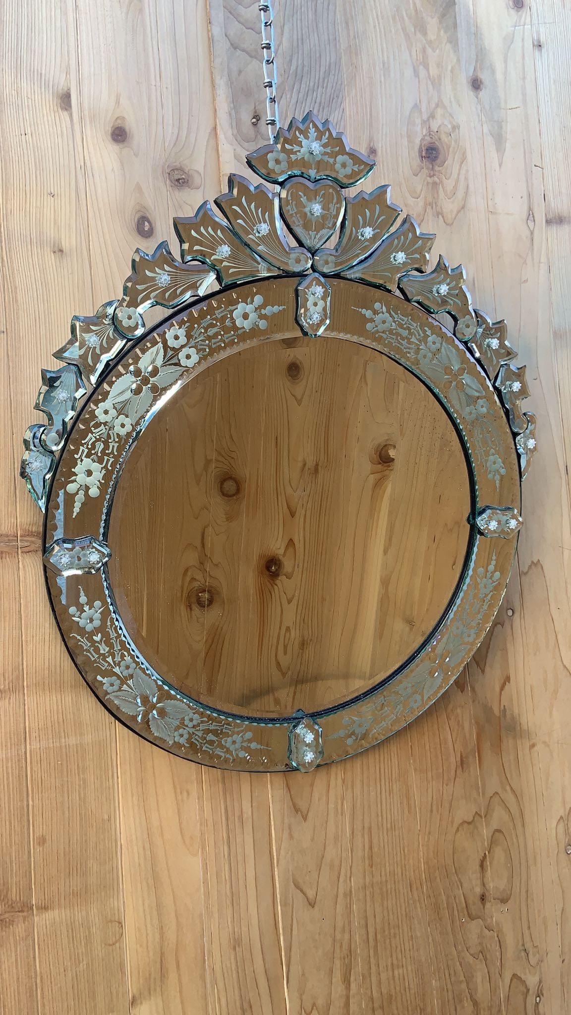 Vintage Venetian Etched Glass Round Wall Mirror

A round Venetian wall mirror with an elaborately detailed frame, decorated with frosted and convex floral designs.

circa 1960

Dimensions:
H: 31”
W: 24”
D: 1”

Good vintage condition
