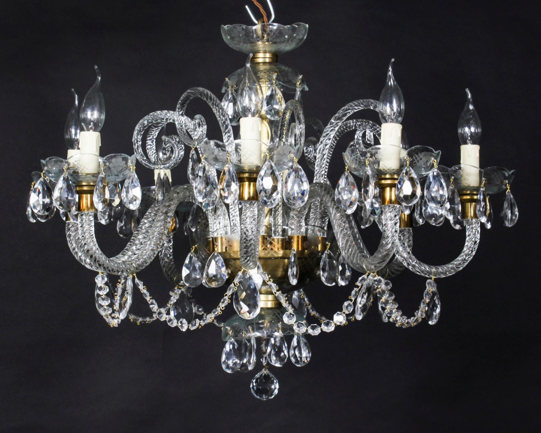 This is a lovely vintage Venetian Revival chandelier with eight lights and beautiful clear crystal drops, dating from the second half of the 20th Century.

Add a touch of class to your home with this beautiful chandelier.

Condition:
It is in