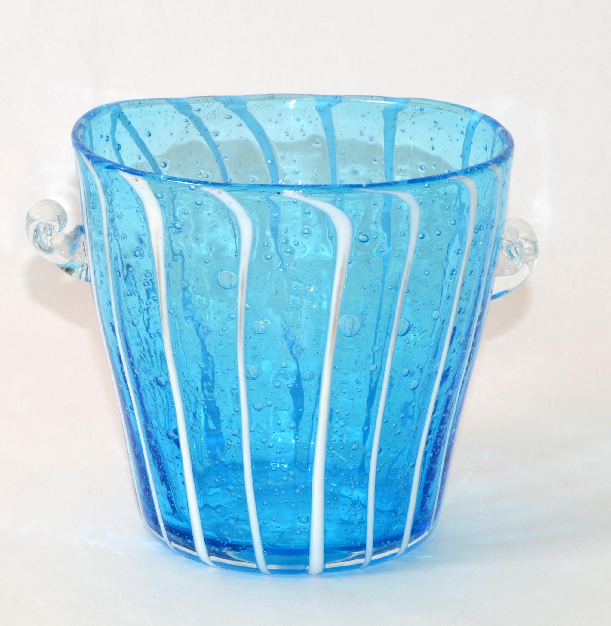 Vintage Venini Murano martini ice cube container in light blue, white & transparent wine cooler, ice bucket made in Italy 1970.
No Makers Logo, Venini For DISARONNO, but it is an original.
Measures from handle to handle: 6.5 inches, Diameter Top