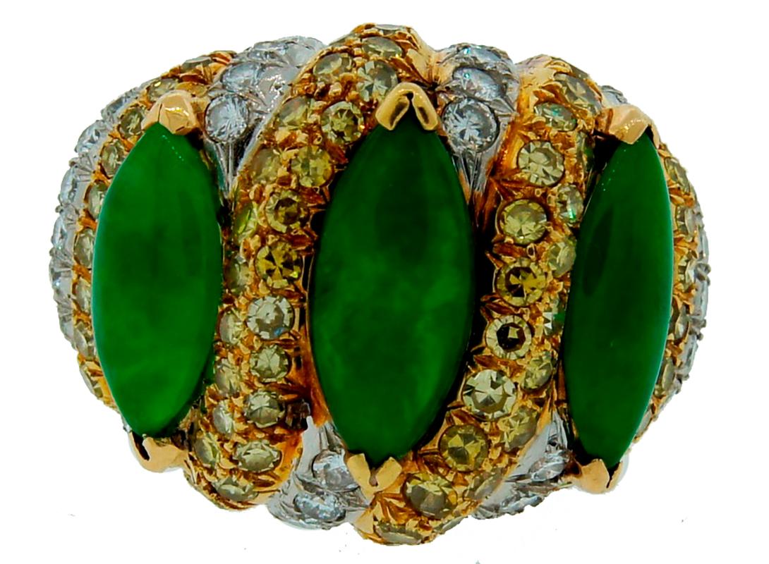 Stunning and rare vintage ring created by Verdura in 1966. Tasteful combination of yellow gold, platinum, yellow and white diamonds and jade turned into this elegant, feminine and colorful cocktail ring. 
Made of 18 karat yellow gold and platinum,