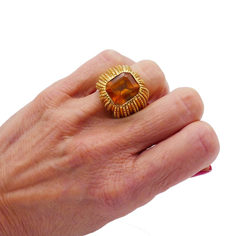 A stunning vintage 18k gold ring by Verdura featuring an emerald cut citrine. This bold scale ring is a head-turner and a conversation starter. 
This textured gold cocktail ring centering an amazing emerald cut citrine with flush setting. The back