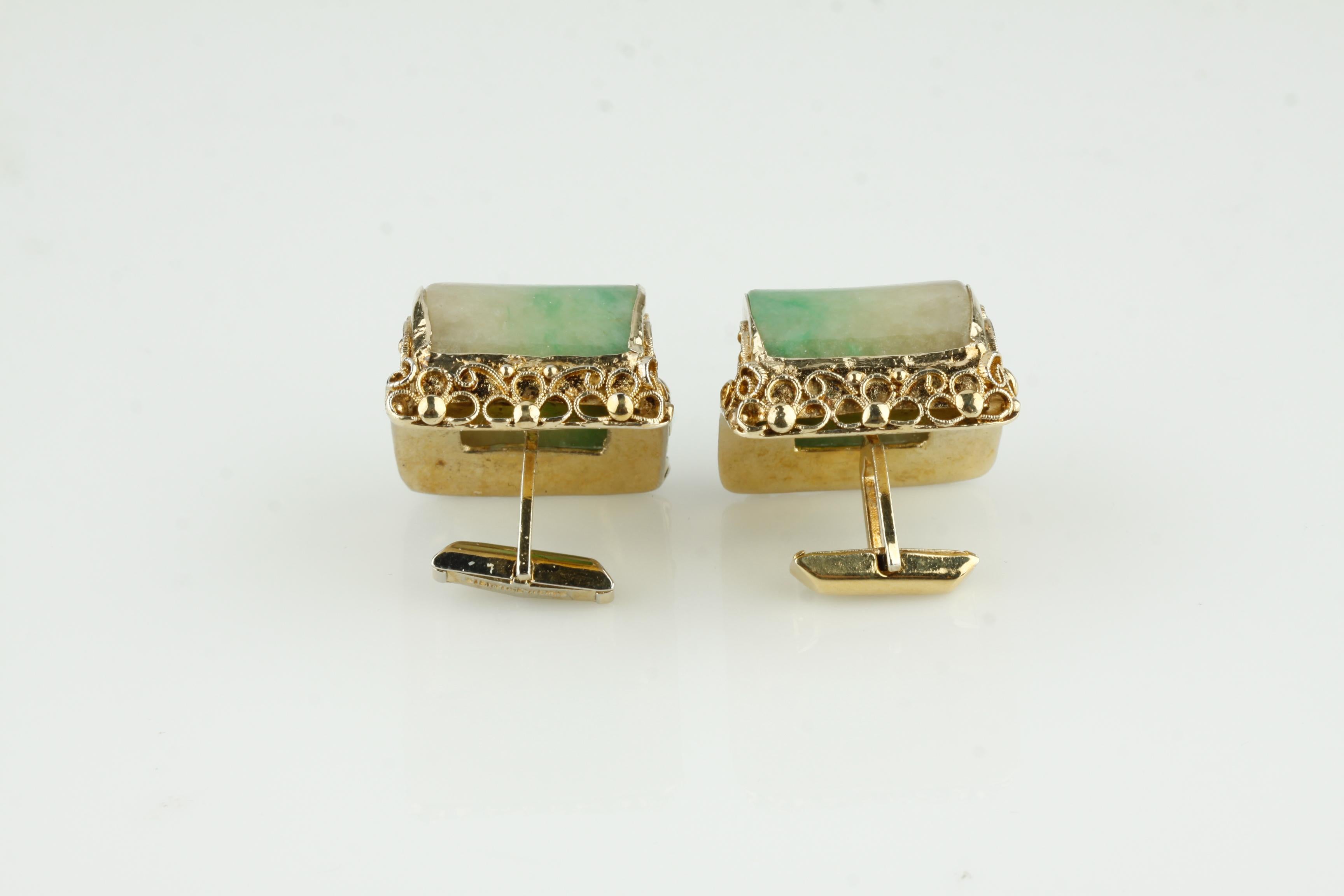Beautiful Jade Cufflinks
Feature Rounded Jade Stones in Gold-Plated Sterling Silver Settings
Settings Ornate with Filigree
Dimensions of Cufflink = 31 mm Long x 29 mm Wide
Total Mass = 42 grams
Gorgeous Pieces!