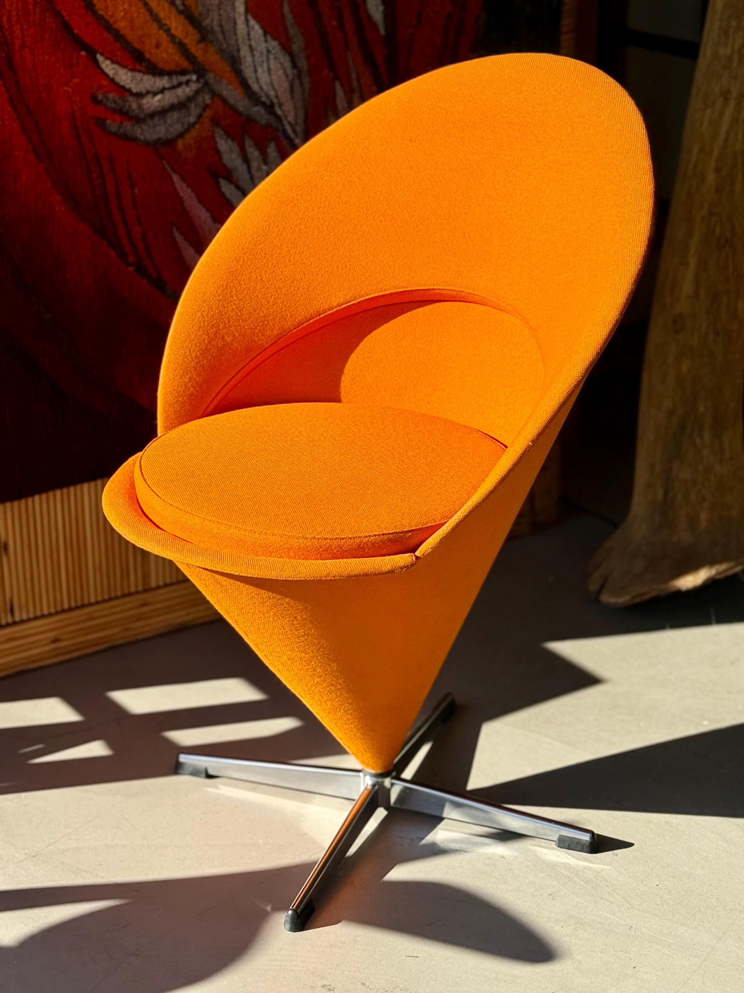 Designed in 1958 by the legendary Verner Panton, the Cone Chair is a bold statement piece that embodies the spirit of mid-century modern design. With its striking geometric silhouette, this chair seamlessly blends sculptural elegance with functional