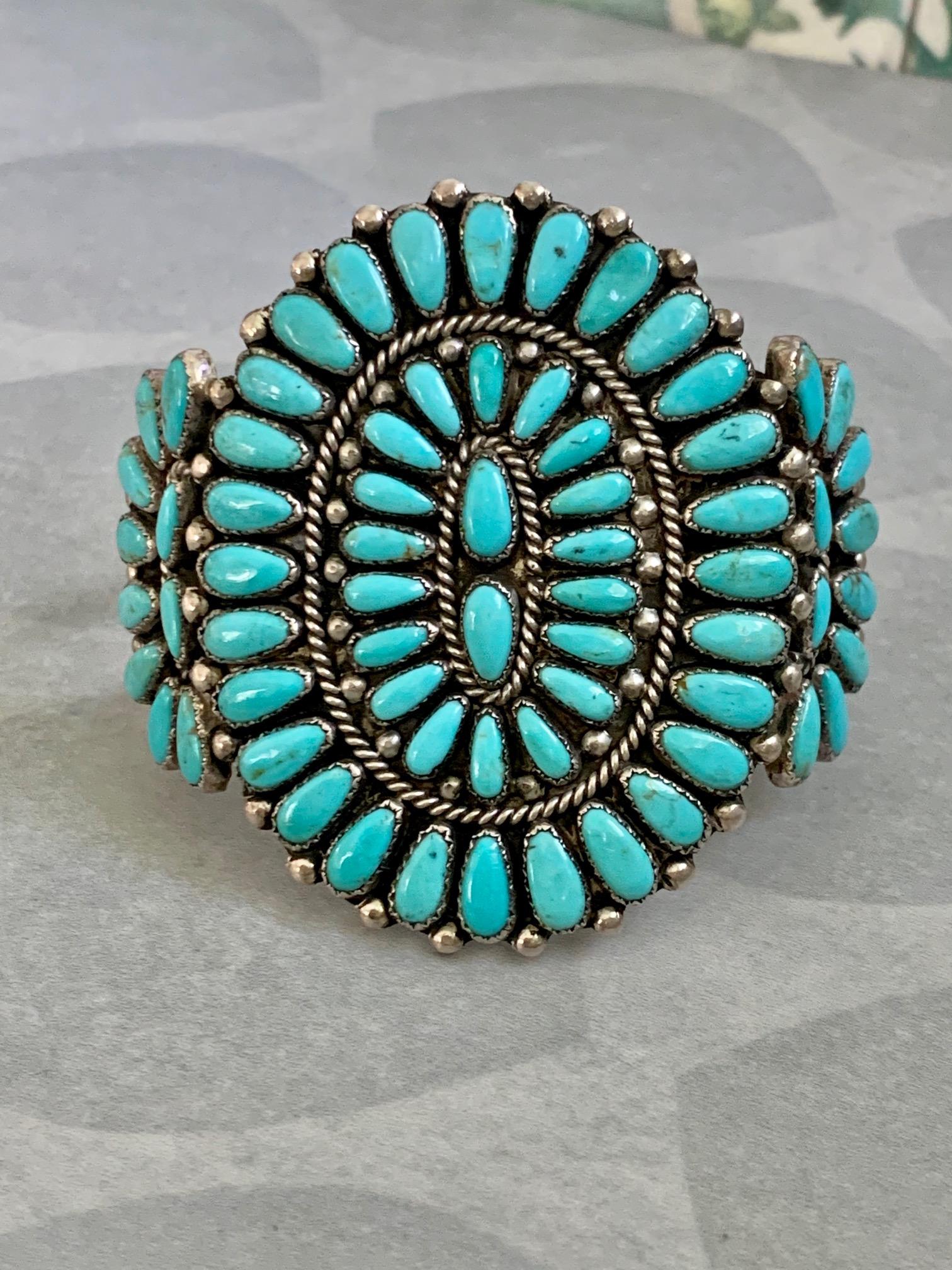 Wow, this piece is stunning!  It is a great example of traditional Navajo Native American jewelry.

It measures 8