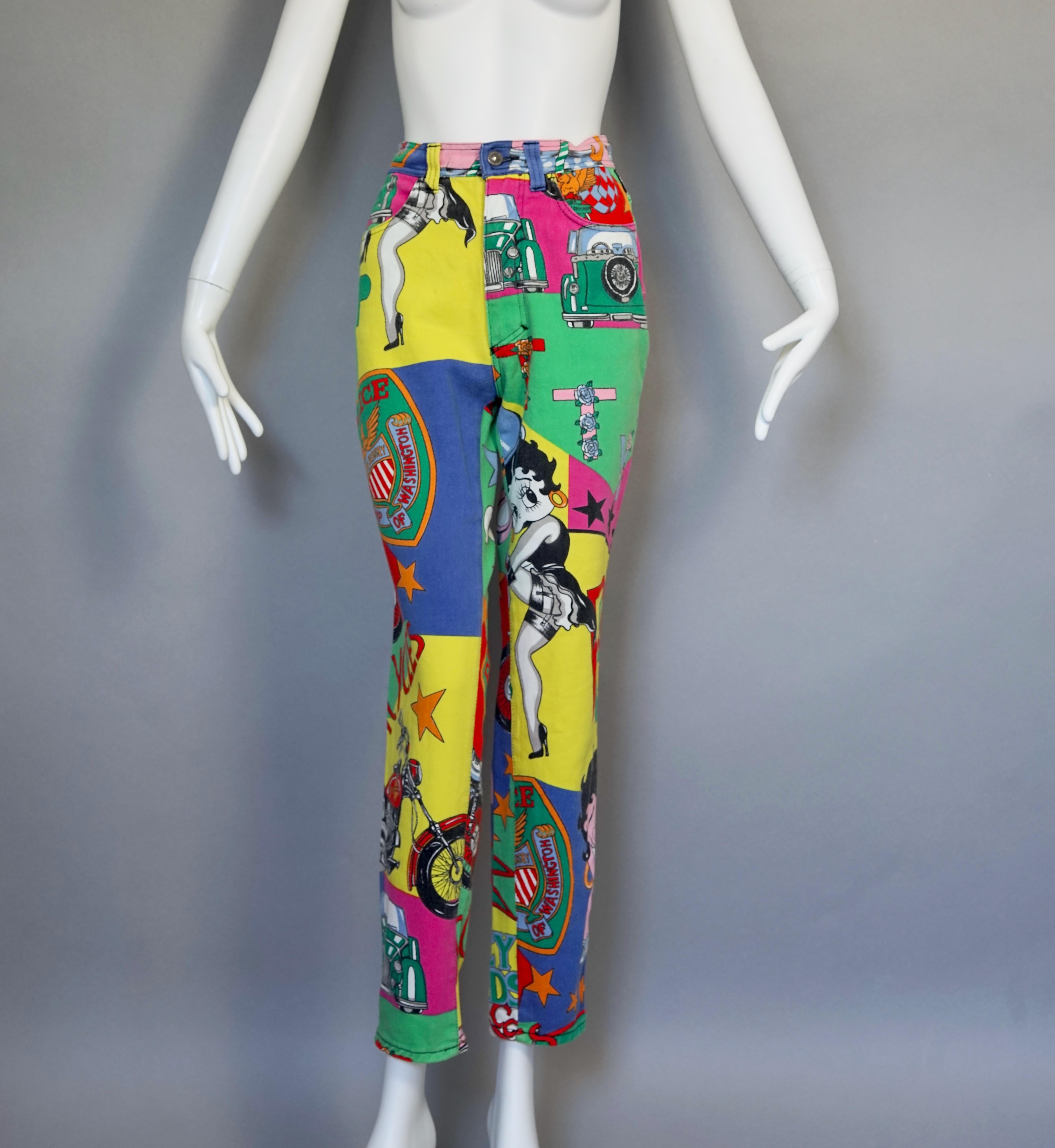 Vintage VERSACE Betty Boop Cartoon Print Pants Jeans Trousers
As seen on Jessie Jay, Kourtney Kardashian(dress version) and Miley Cyrus (jumpsuit version).

Measurements taken laid flat, double waist and hips:
Waist: 14.17 inches (36 cm)
Hips: 19.29