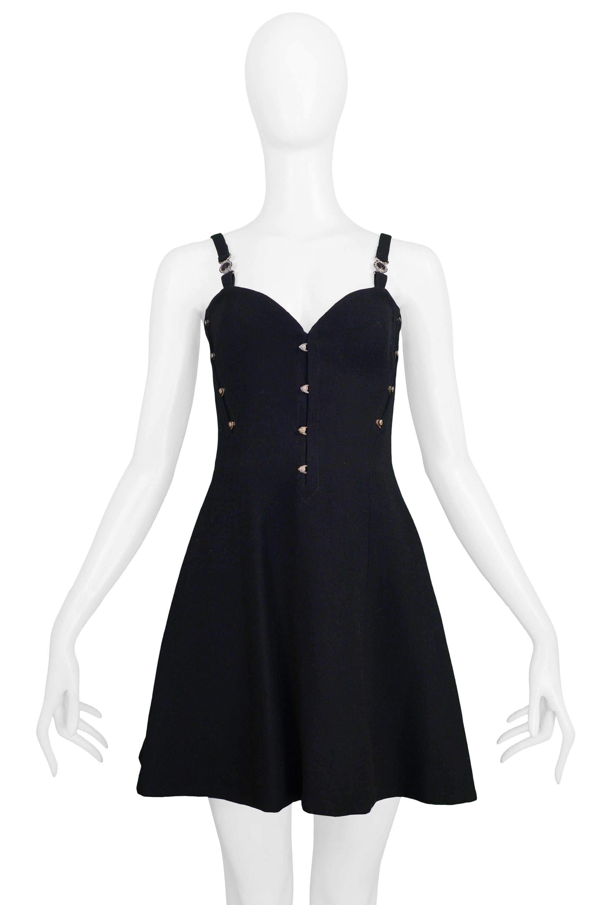 Resurrection Vintage is excited to offer a vintage Versace black bustier mini dress featuring a fitted bodice with goldtone metal tabs, Medusa medallions on the straps, and skater style skirt. 

Versace 
Measurements: Approx Bust: 32