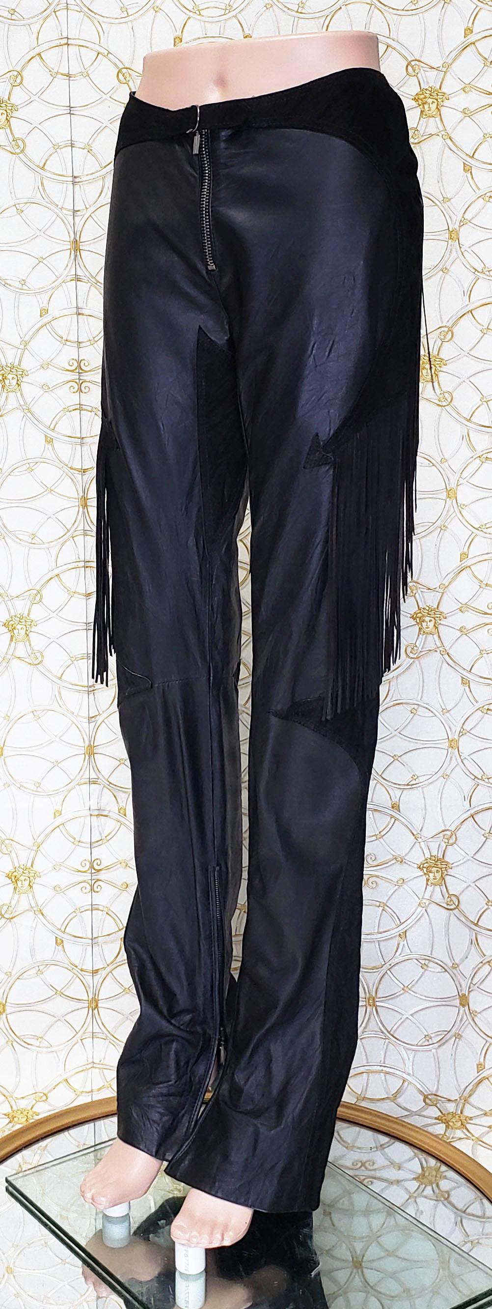 VERSACE 

Resurrection Vintage is excited to offer a pair of vintage Versace 
 crinkle leather pants featuring an exposed silver-tone center front zipper,
 attached yoke with buckle,
 fringe at the sides and back, 
arrow inserts,
 ankle