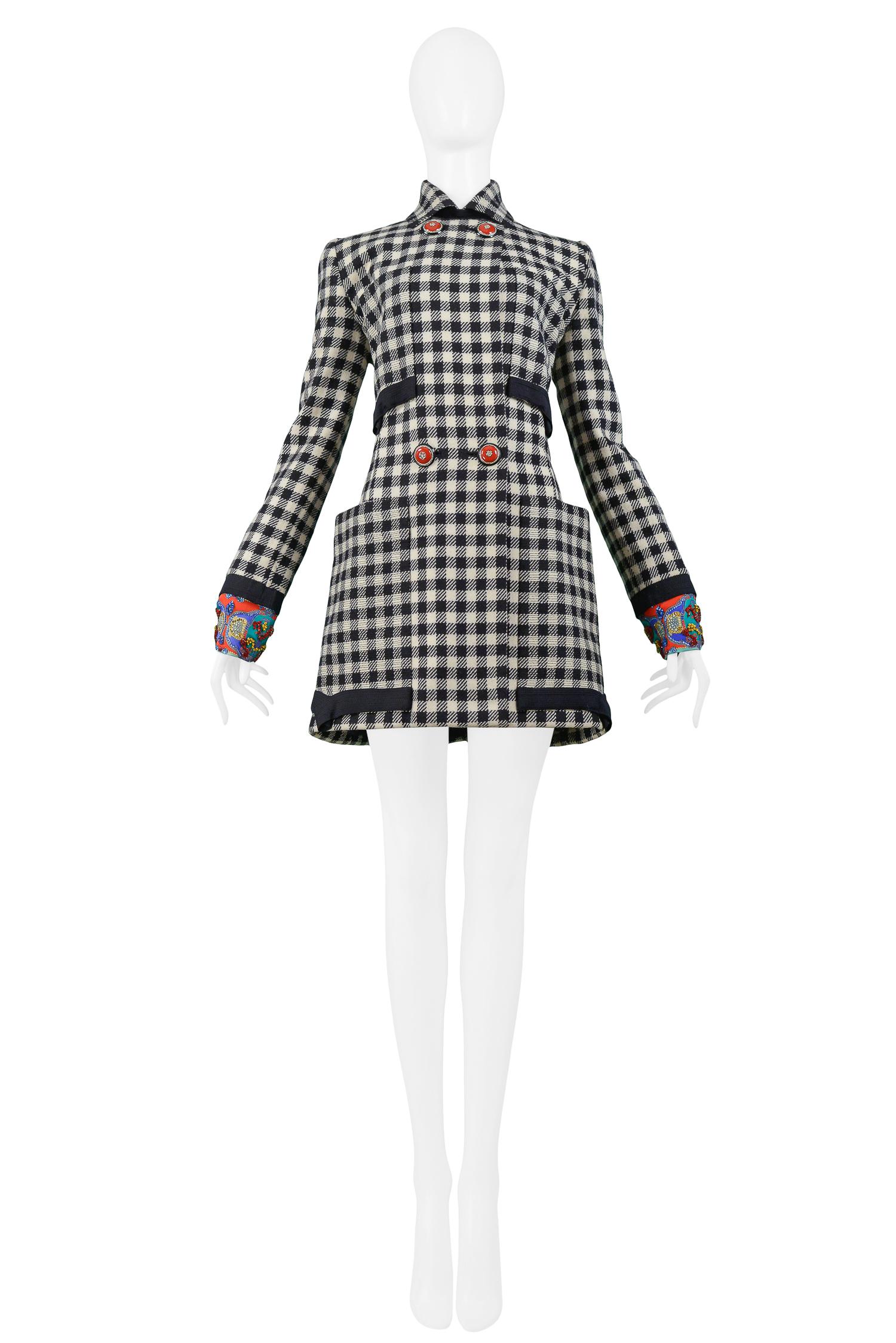 Rare and unusual vintage Gianni Versace Atelier runway black and white 100% Lana wool check coat The coat features a double-breasted front with stunning red metal and crystal buttons, five matching buttons on the cuffs, four front pockets with black