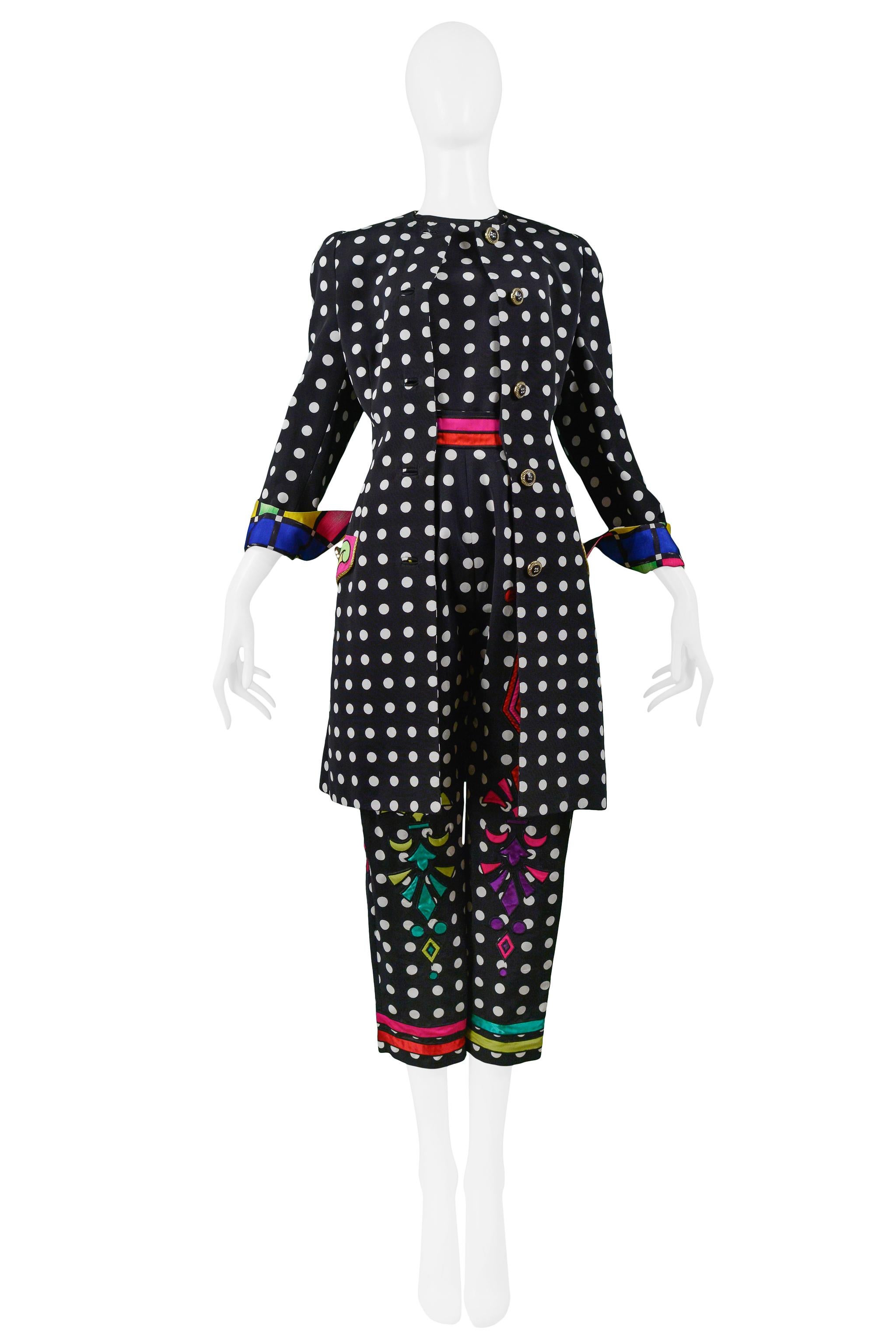 Rare and unusual vintage Gianni Versace black and white dot ensemble featuring a sleeveless top and high-waisted pants with matching coat. The pants and coat feature multicolor stripes and patterns on the waist, pant legs, and on coat sleeve cuffs