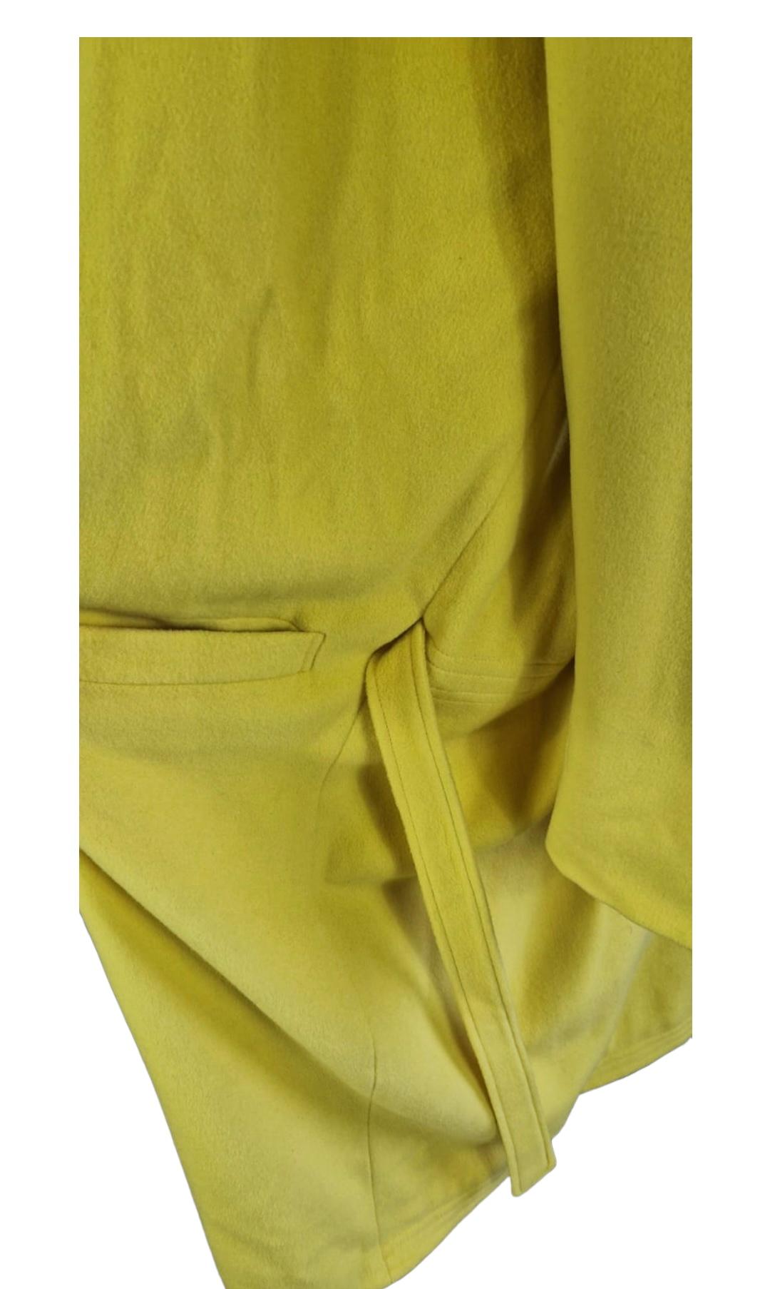 Vintage Versace coat in yellow wool, indicated size 42 but very over fit. 
Waist belt not visible from the outside because it passes internally between the coat and the inner lining. Mixed nylon and cupro interior always yellow with embroidered