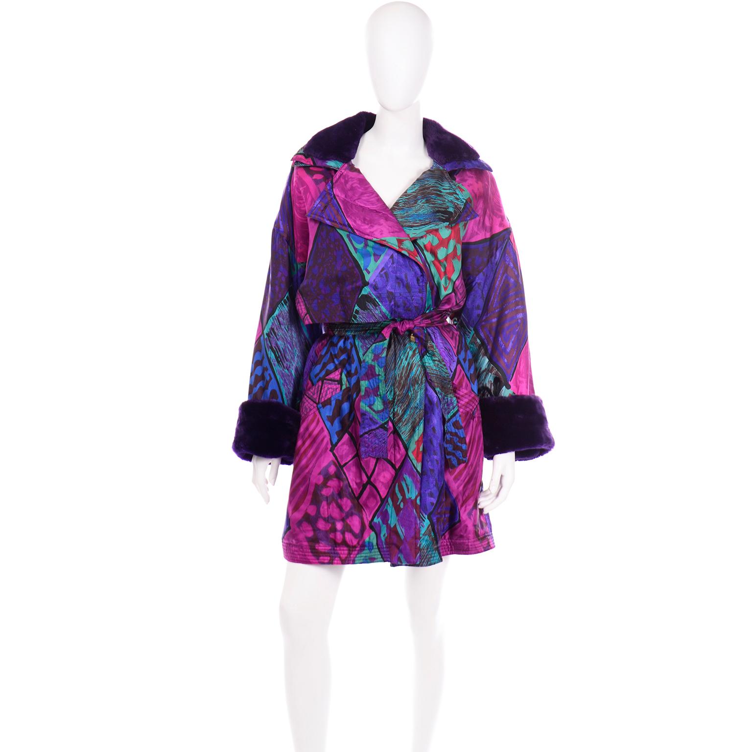 This vintage Versace Sport coat is simply gorgeous and we love the colorful silk fabric with purple faux fur collar and cuffs. The colors of the abstract silk print consist of purple, magenta, burgundy, green, teal, blue, and black. This coat has