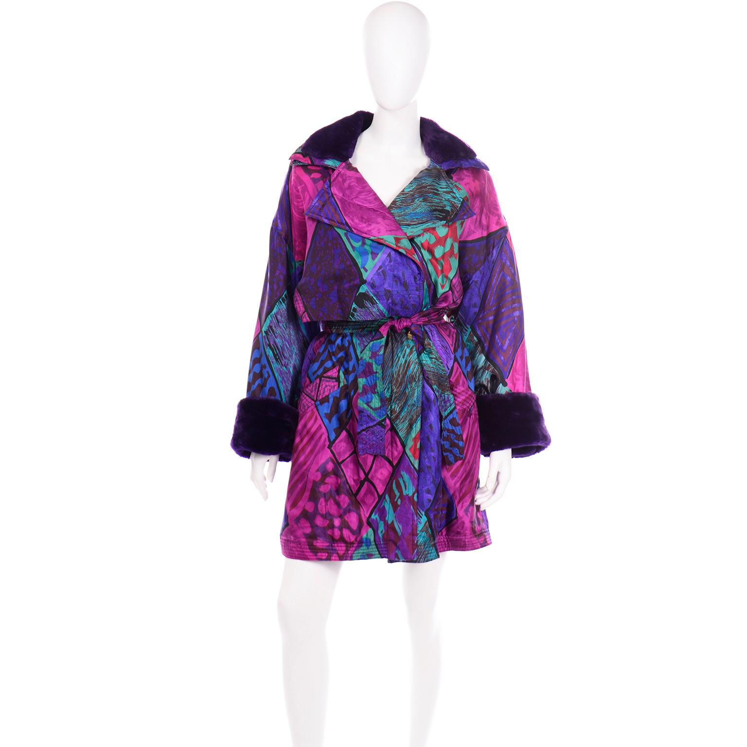 This vintage Versace Sport coat is simply gorgeous and we love the colorful silk fabric with purple faux fur collar and cuffs. The colors of the abstract silk print consist of purple, magenta, burgundy, green, teal, blue, and black. This coat has