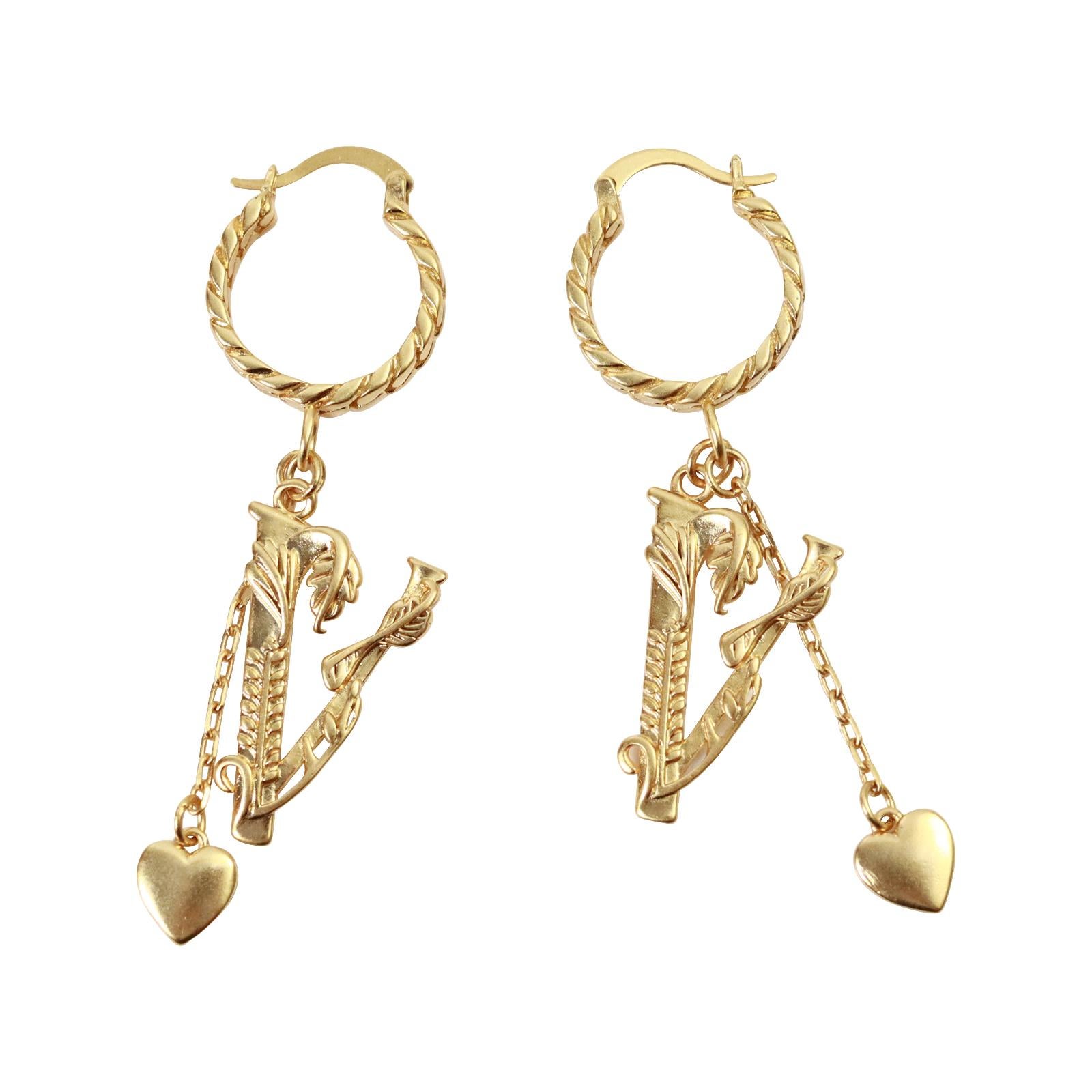 Vintage Versace Gold Tone Dangling Pieces Hoop Earring Circa 2000s.  These great earrings have a small hoop with a long dangling V which has a vine wrapped around it which has a flower on one end and leaves on the other all going up the V. There is