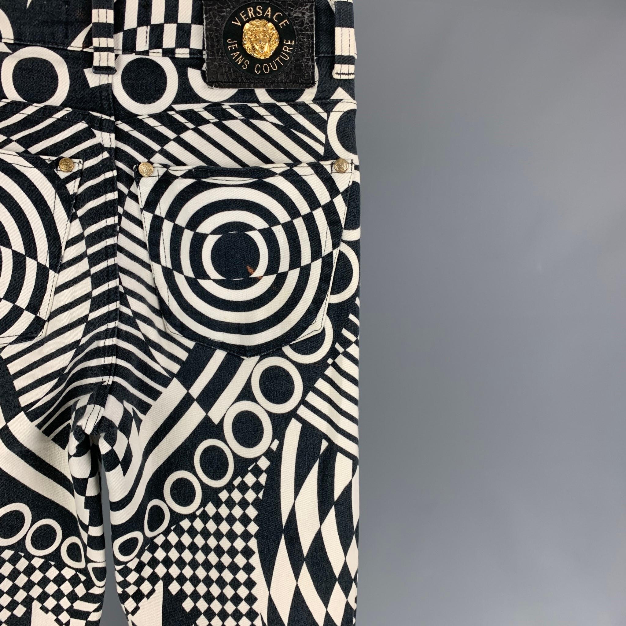 Vintage VERSACE JEANS COUTURE pants comes in a white & black abstract print cotton featuring a skinny fit, gold tone medusa head buttons, and a zip fly closure. Made in Italy. 

Very Good Pre-Owned Condition. Light mark at back. As-Is.
Marked: