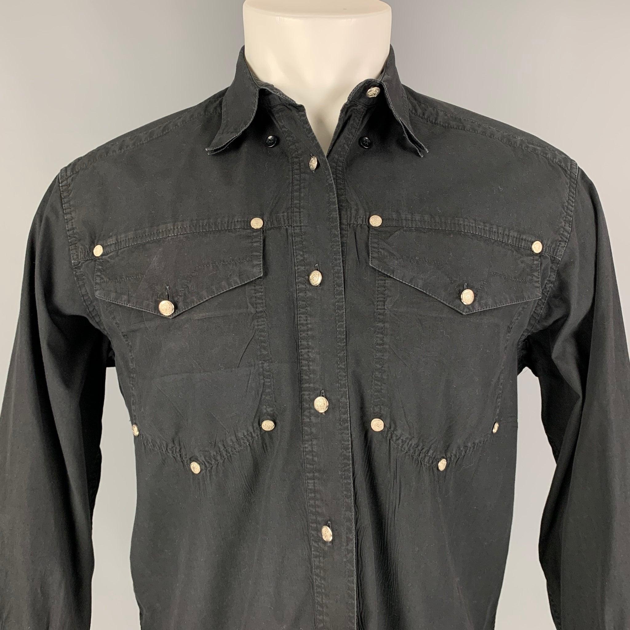Vintage VERSACE JEANS COUTURE long sleeve shirt comes in a black cotton featuring a button down collar, front pockets, and a silver tone medusa logo buttoned closure.
Good
Pre-Owned Condition. 

Marked:   Size tag removed.  

Measurements: 
