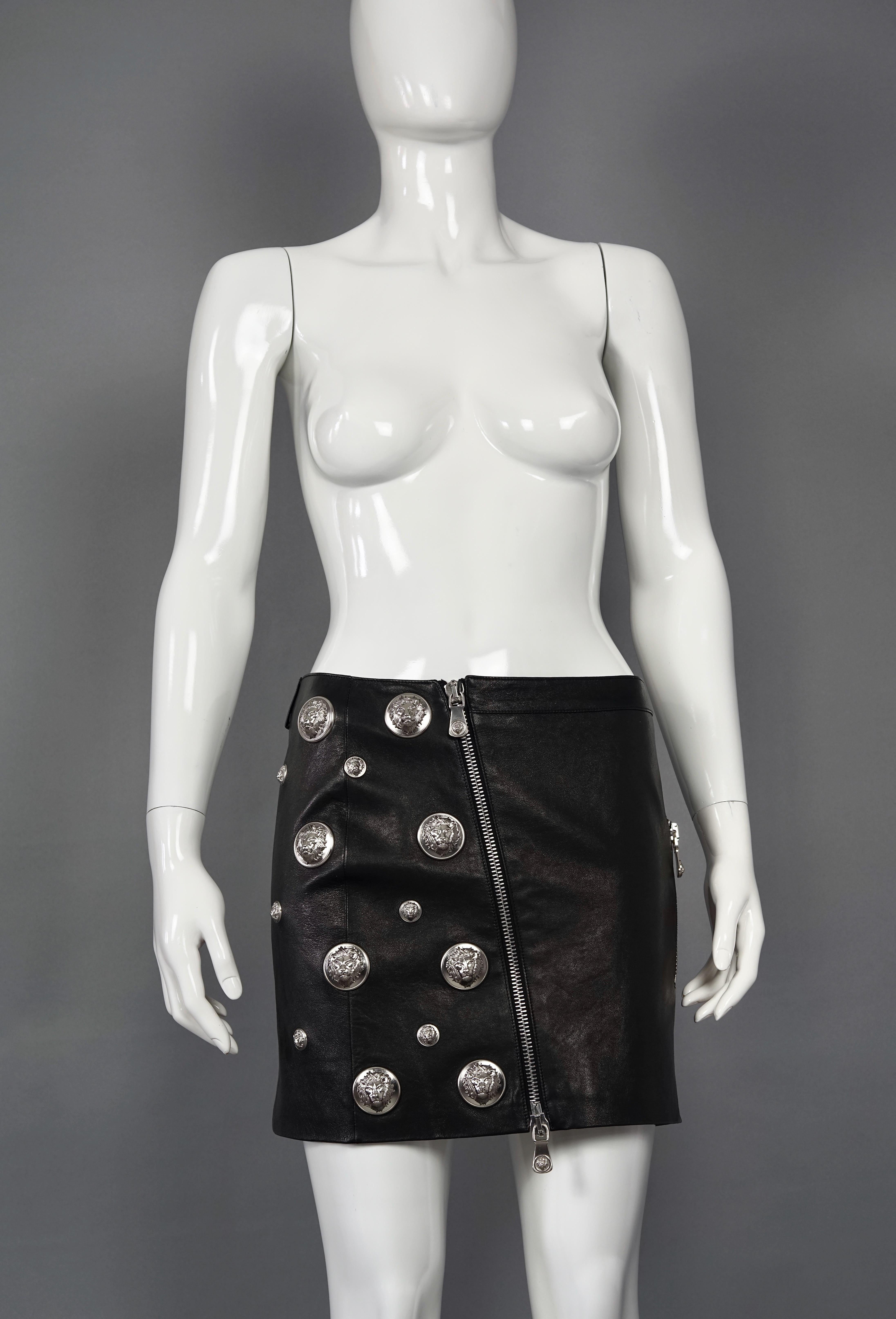 Vintage VERSACE Lion Head Black Leather Skirt

Measurements taken laid flat, please double waist and hips:
Waist: 14.96 inches (38 cm)
Hips: 17.32 inches (44 cm)
Length: 14.56 inches (37 cm)

Features:
- 100% Authentic VERSACE VERSUS.
- Black