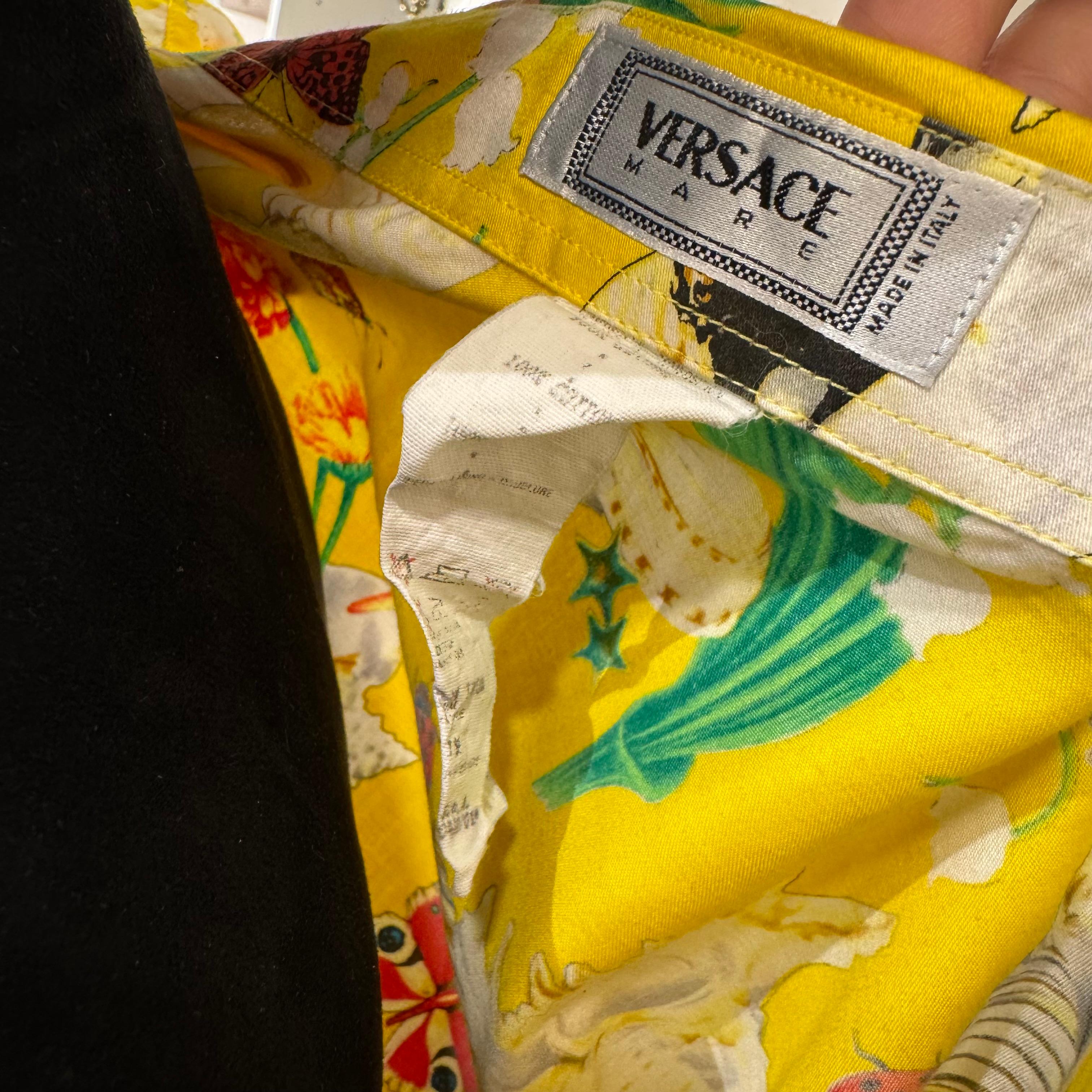 Vintage versace mare short sleeve men shirt. Fun print in very vibrant color. 100% Cotton. Oversized fit. Label stated 48 which is men’s medium but fits up to XL. Very well kept condition, no dirt marks. Iconic pastel yellow medusa button on the