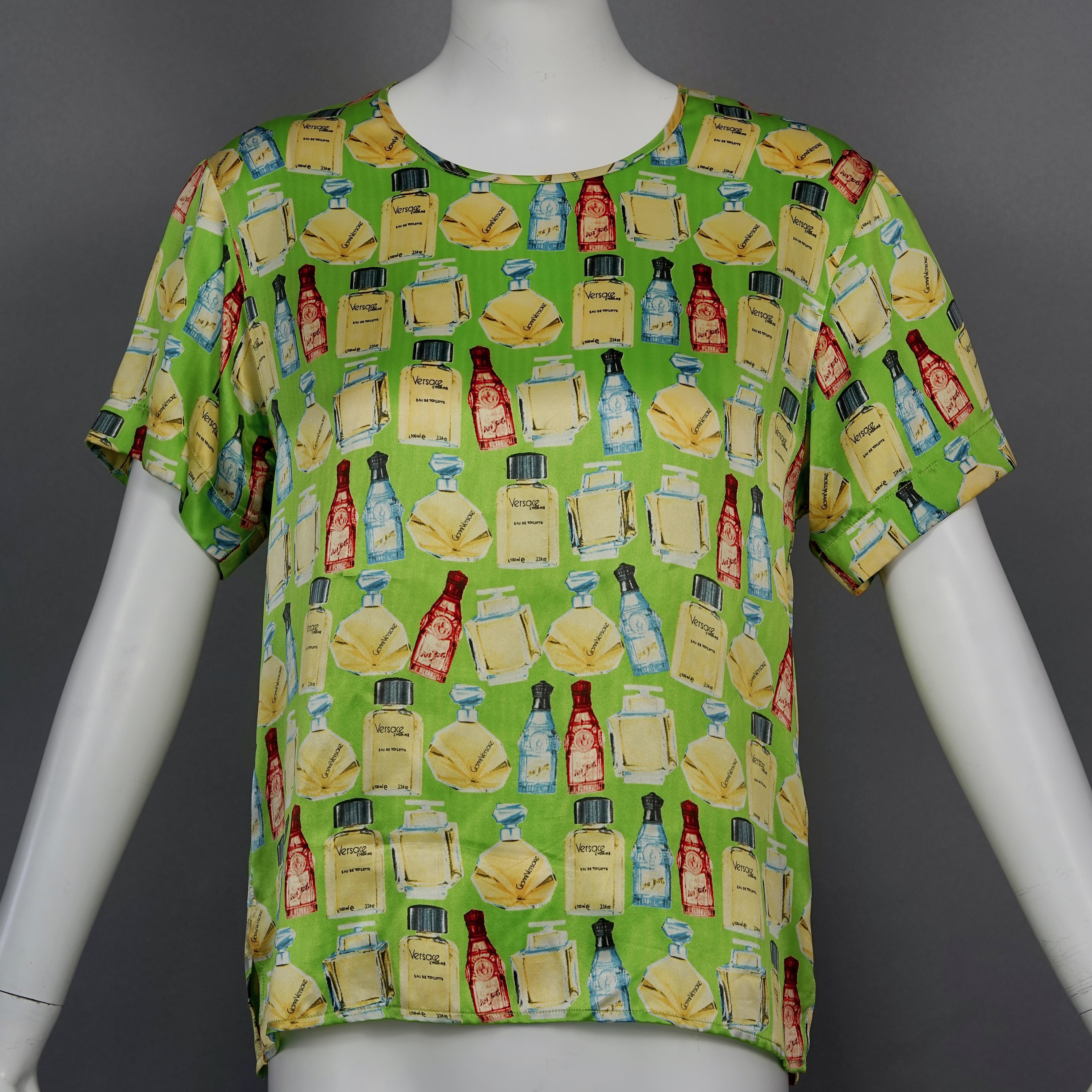 Vintage VERSACE Silk Perfume Print Green Novelty Blouse Top

Measurements taken laid flat:
Shoulders: 16.92 inches (43 cm)
Sleeves: 7.87 inches (20 cm)
Bust: 18.89 inches (48 cm)
Waist: 18.50 inches  (47 cm)
Length: 24.40 inches (62 cm)

Features:
-