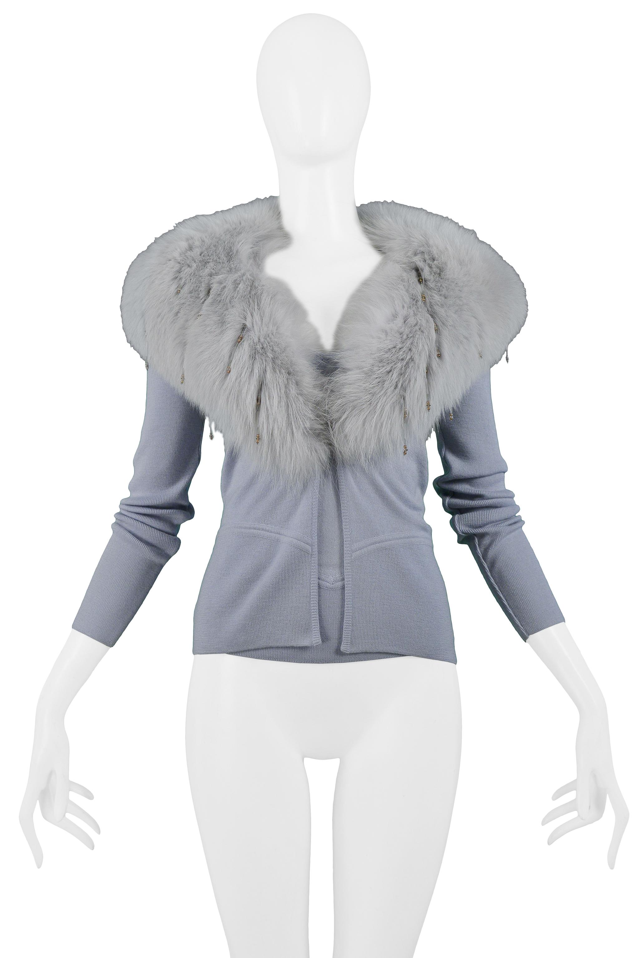 Vintage Gianni Versace powder blue knit cardigan with a fox fur collar that features beaded accents, and a matching knit camisole with ribbed bustline and waistline.

Excellent Vintage Condition.

Both Pieces Size 40