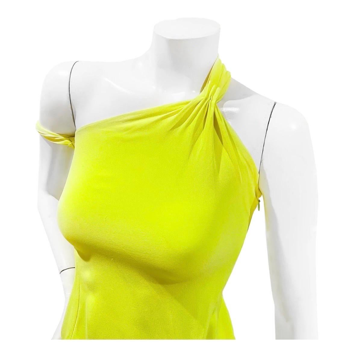 Vintage Yellow Neon Halter Dress by Gianni Versace
Fall / Winter 2002
Made in Italy 
Bright yellow neon
Bottom layer ruffle hem detail 
Sleeveless
Halter style dress
Side invisible zip and clasp closure
One shoulder style strap
Extra fabric detail