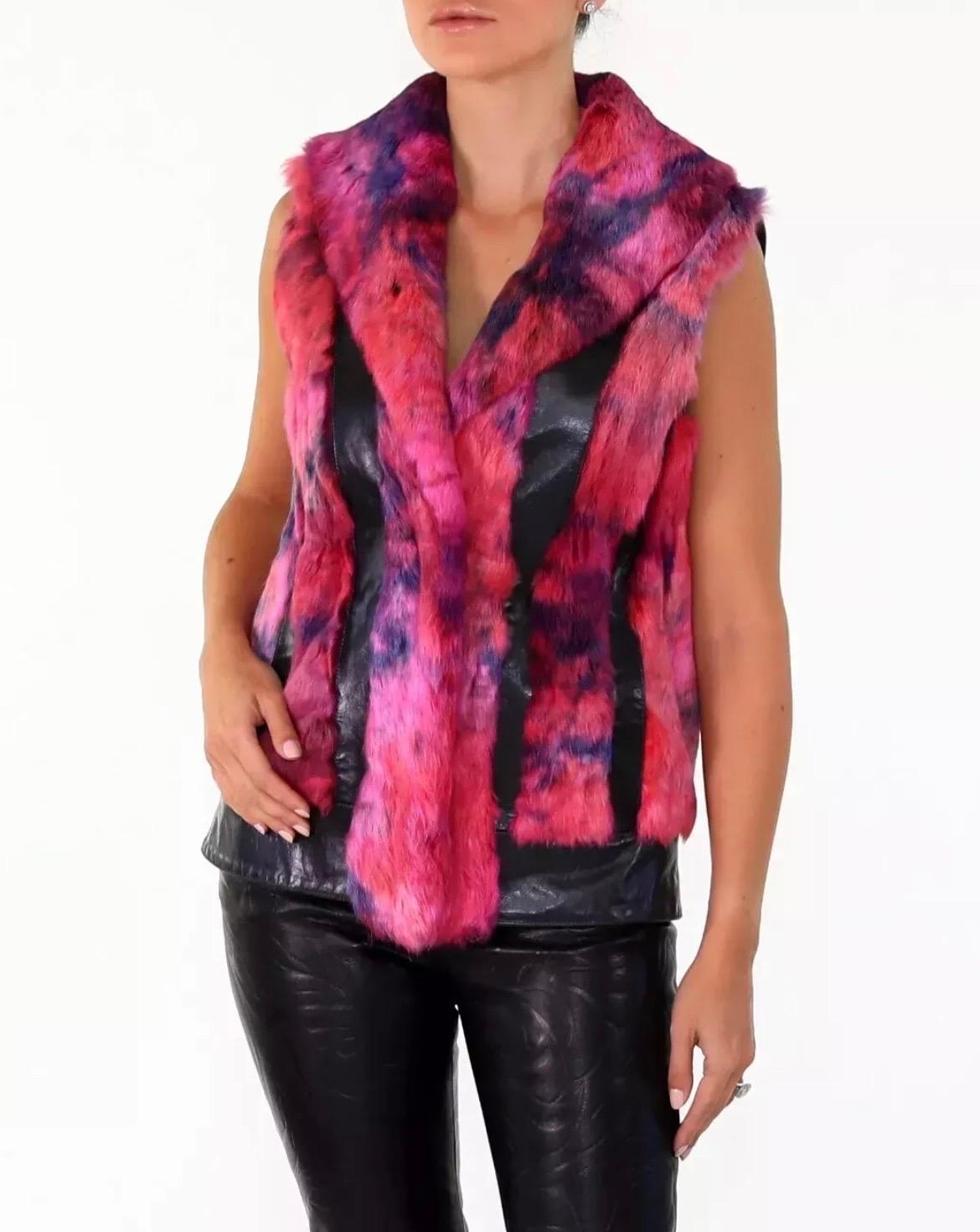 VERSUS VERSACE
FUR SLEEVELESS JACKET
This sexy showstopper is as fun as it is fabulous. 
Made of impossibly soft rabbit fur and accented with smooth leather. Fully lined. 
Two side pockets. 
 IT Size 42
Measures up to 38 inches around the bust, the