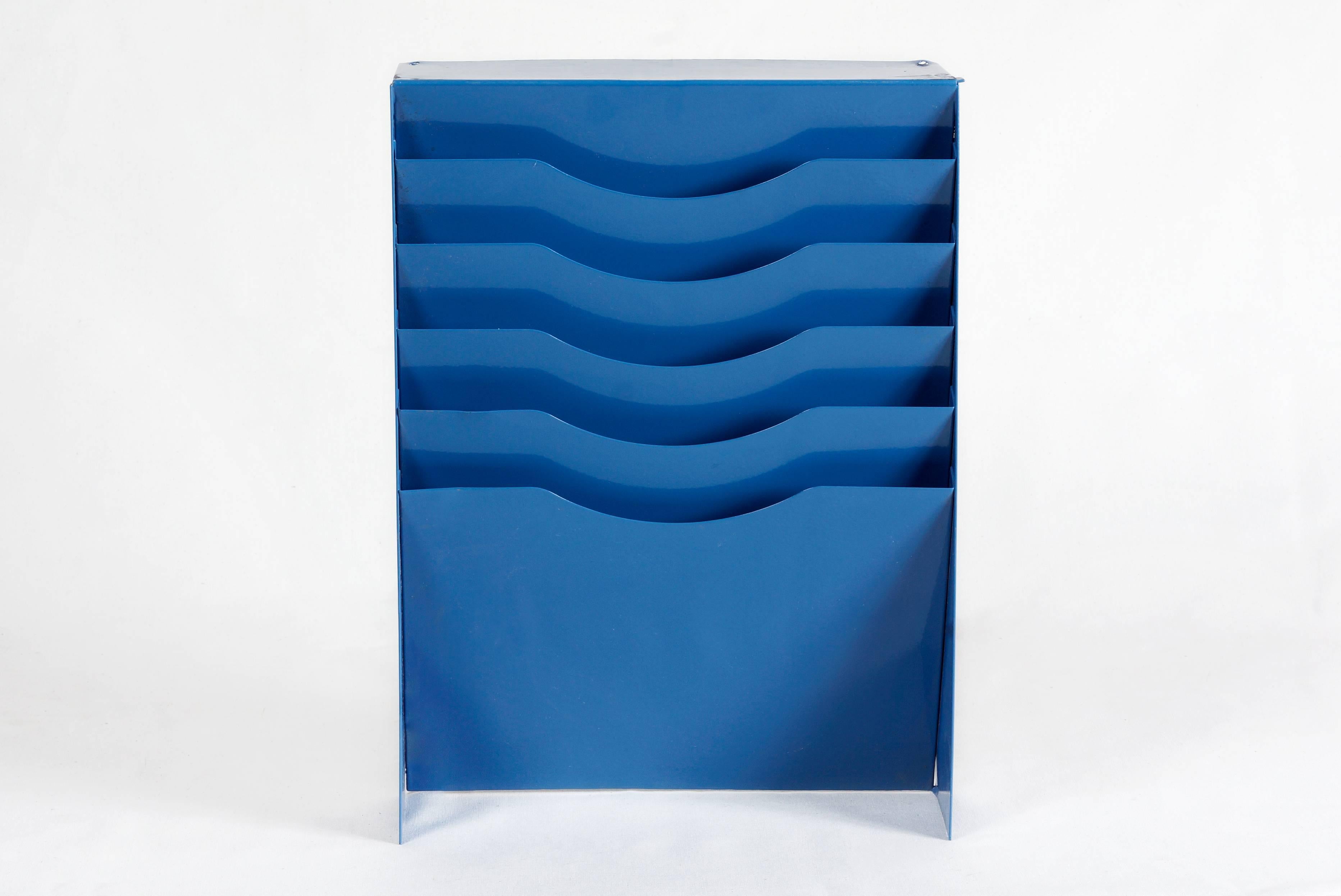 Vintage file holder or magazine rack refinished in moon blue powder coat. Once the drawer insert to a tanker piece, we repurposed it for versatile use. This functional, retro style piece is perfect for getting any home or office organized. Easily