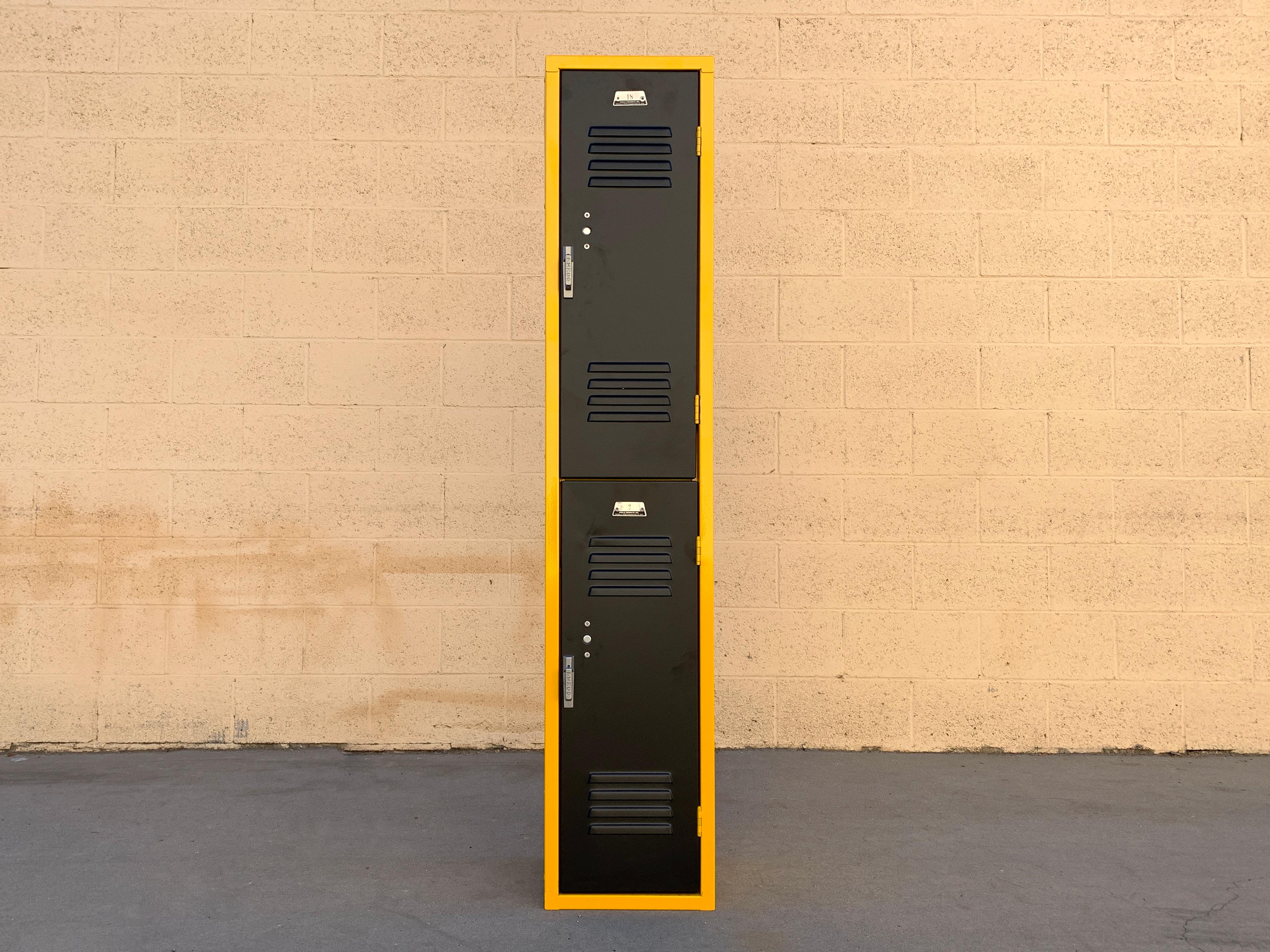 1970s vintage all-American locker unit refinished in Ochre Yellow (RAL 1003) and Matte Black powder coat. Stacked, double door configuration with original tags, PENCO PRODUCTS/ VESPER CO, PA,

Very good refinished vintage condition. Newly powder