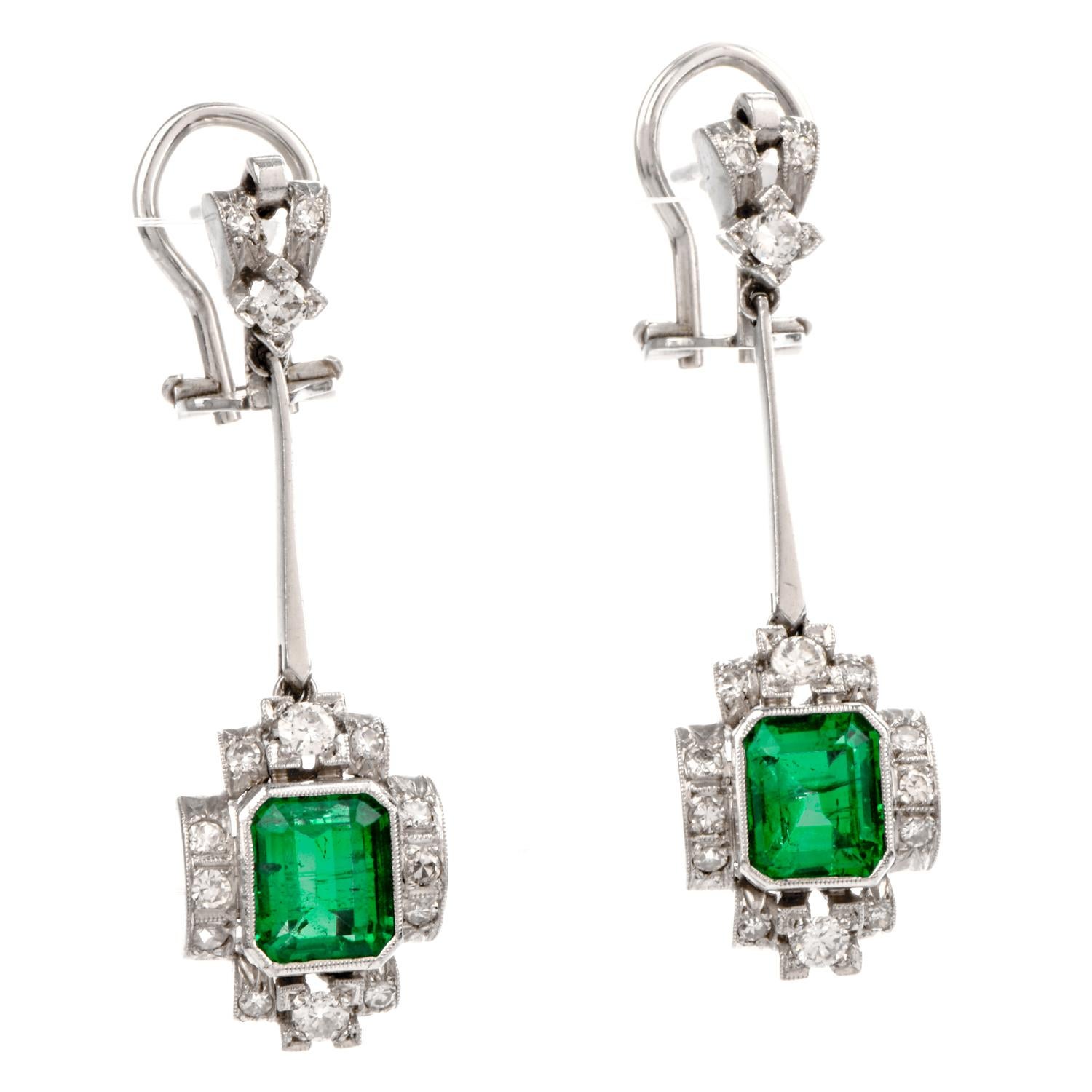 These stunning emerald and diamond dangle drop earrings are crafted in solid 18-karat white gold, weighing 11.0 grams and measuring 40mm long x 12mm wide. The geometric drop exposes a pair of bezel-set, emerald-cut genuine High quality GIA lab