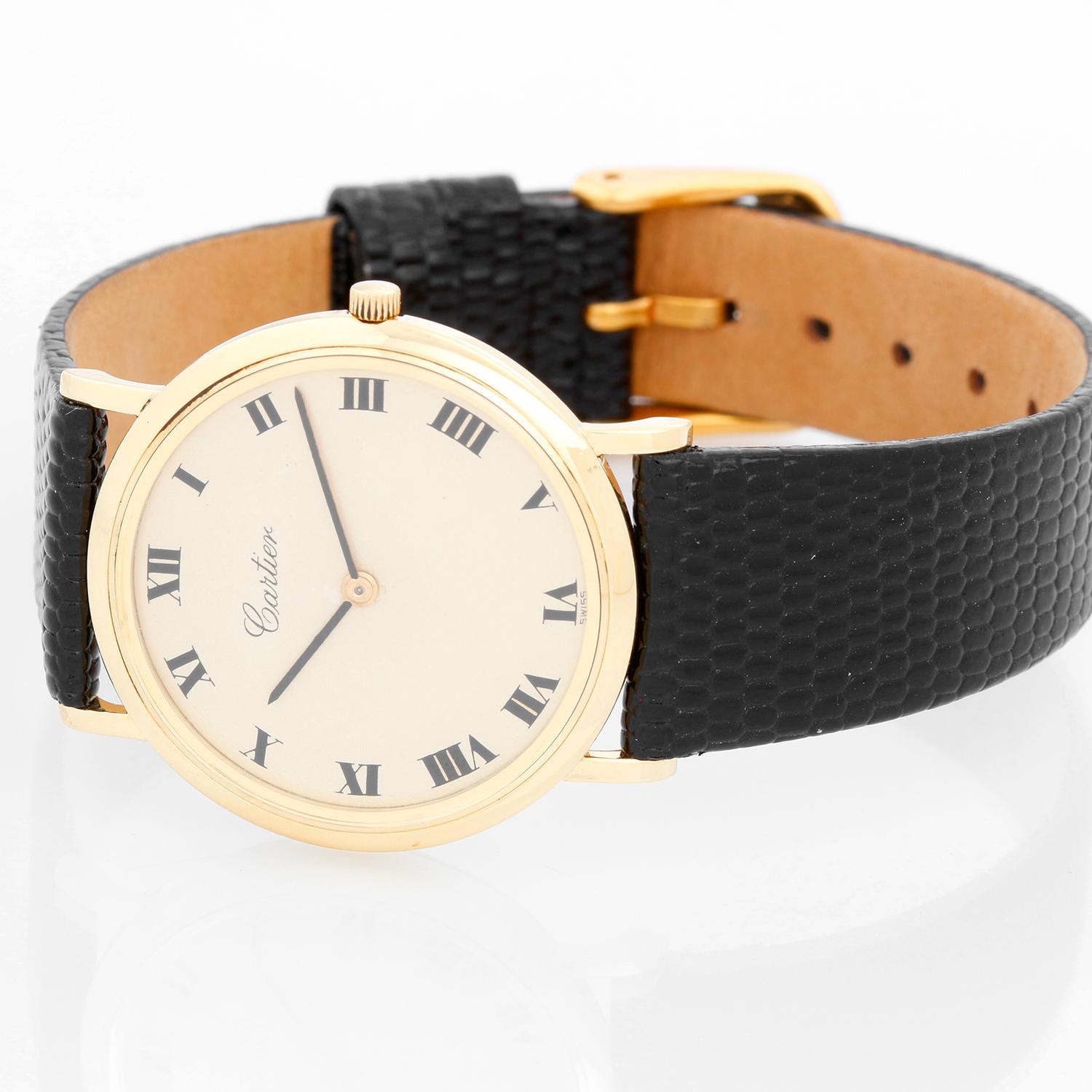 Vintage Very Rare Audemars Piguet Retail by Cartier Yellow Gold Manual Watch - Manual winding; movement by Audemars Piguet. 18K Yellow gold ( 32 mm ) Hand stamped Cartier numbers on case lug. Silvered dial with Roman numerals. Black lizard strap