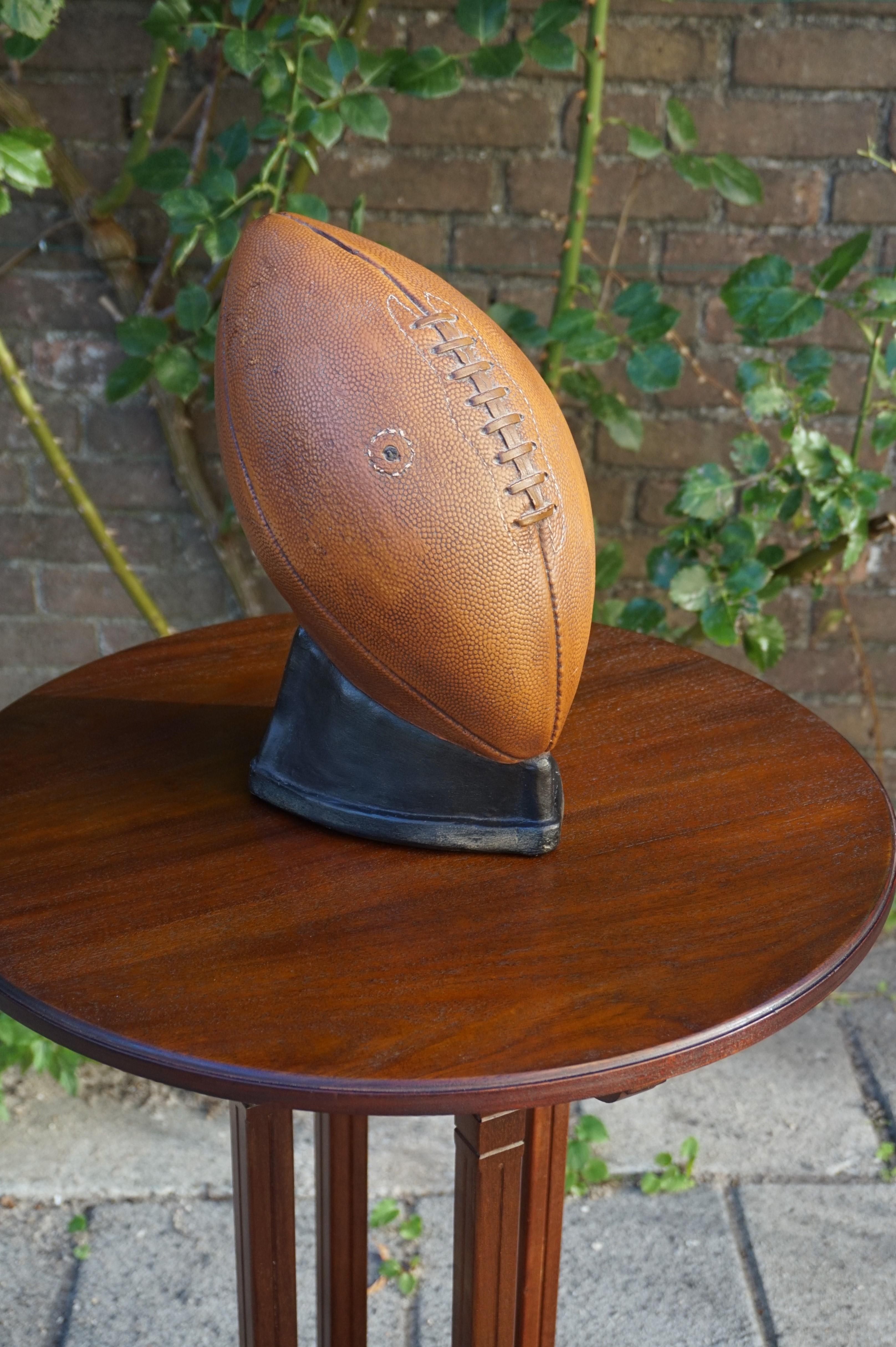 Authentic looking and rare, all American money box.

According to the relatives from whom we purchased this rare money box, the former owner traveled a lot through the USA and Canada where he fell in love with 'American Football'. He took this rare