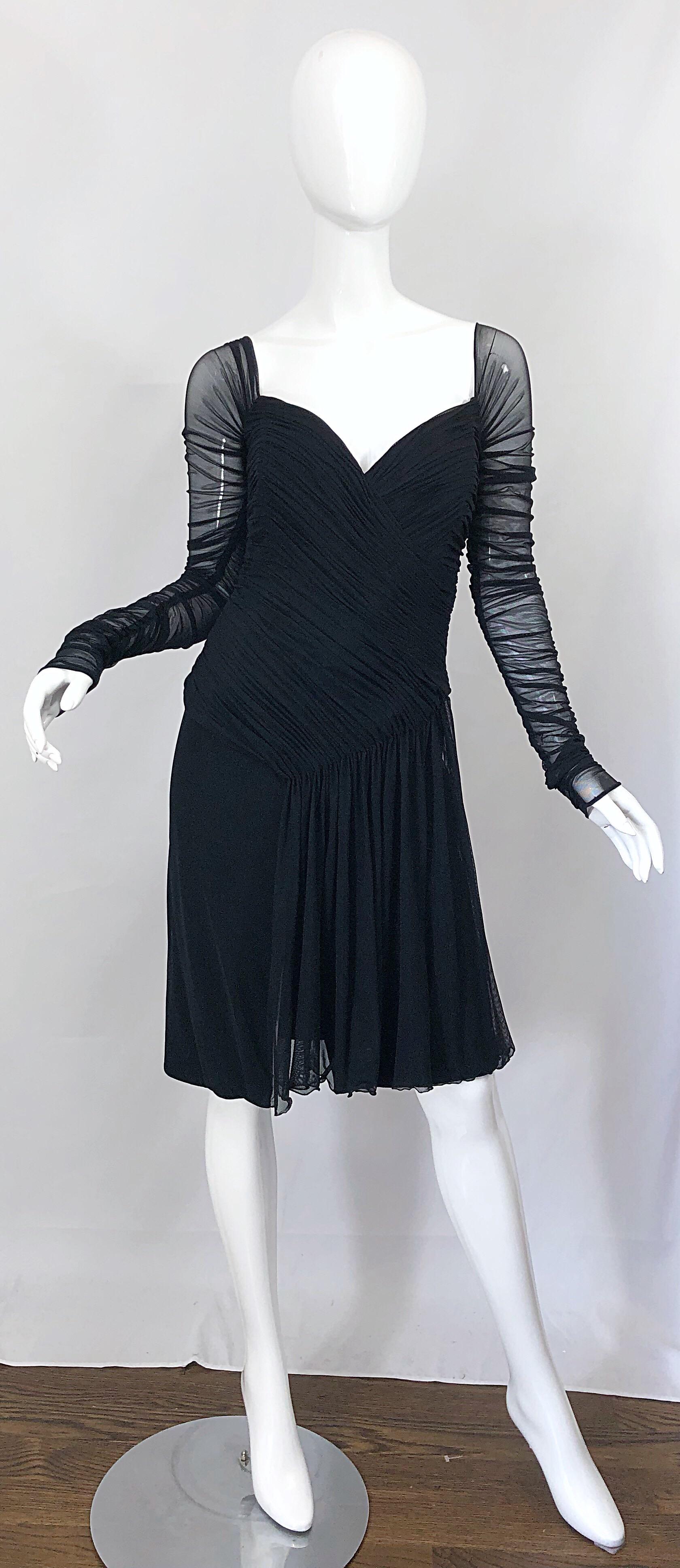 Beautiful vintage late 80s VICKY TIEL COUTURE mesh sweetheart neckline flirty little black dress! Features the designer's signature flattering ruched bodice (features interior boning to keep everything in place). Semi sheer long mesh sleeves. Fitted