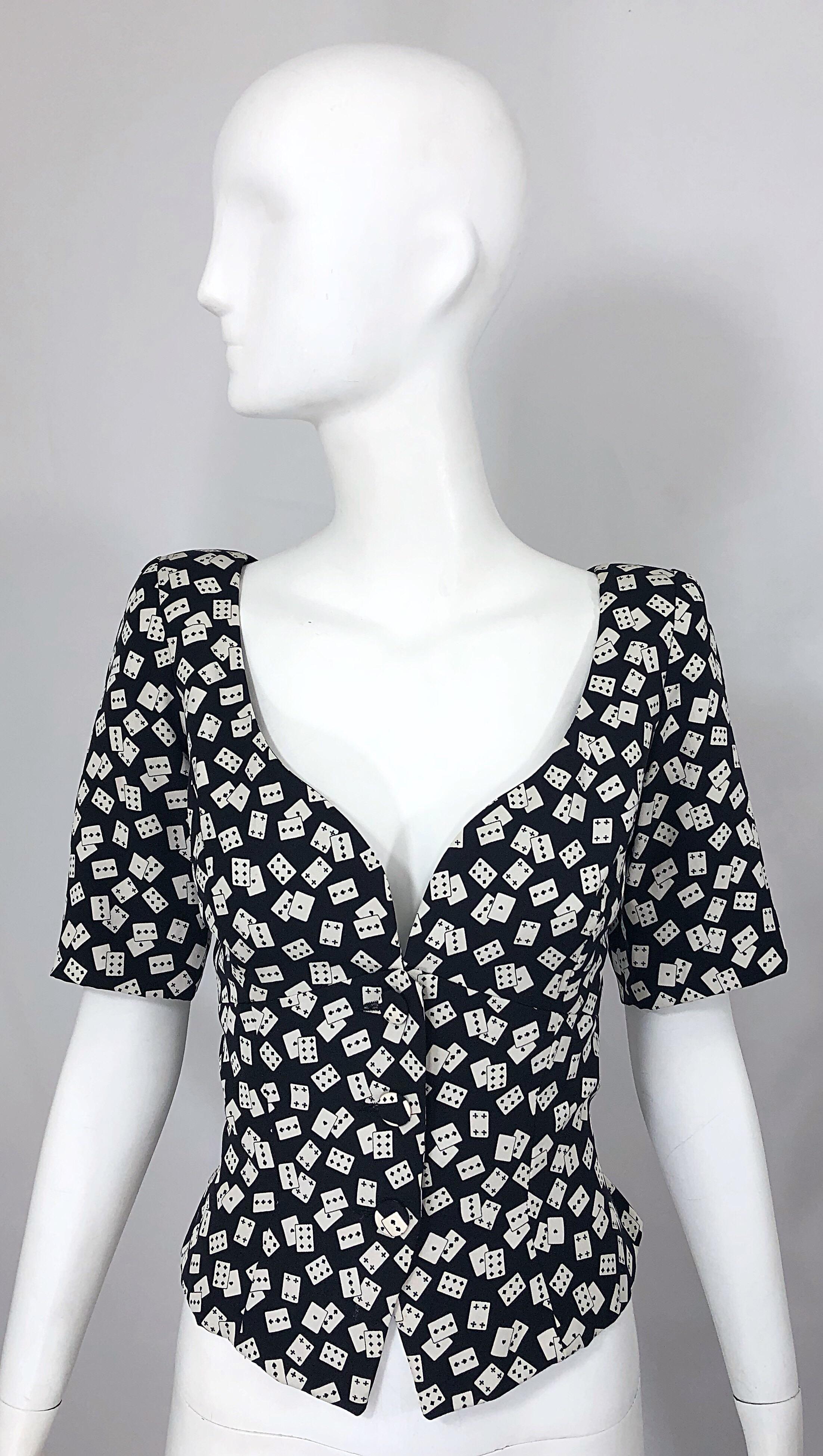 Incredible vintage 1980s VICKY TIEL COUTURE black and white novelty playing cards print short sleeve silk jacket top! Features Tiel's signature fit with a flattering sweetheart neckline. Silk covered buttons up the front with hook-and-eye closure