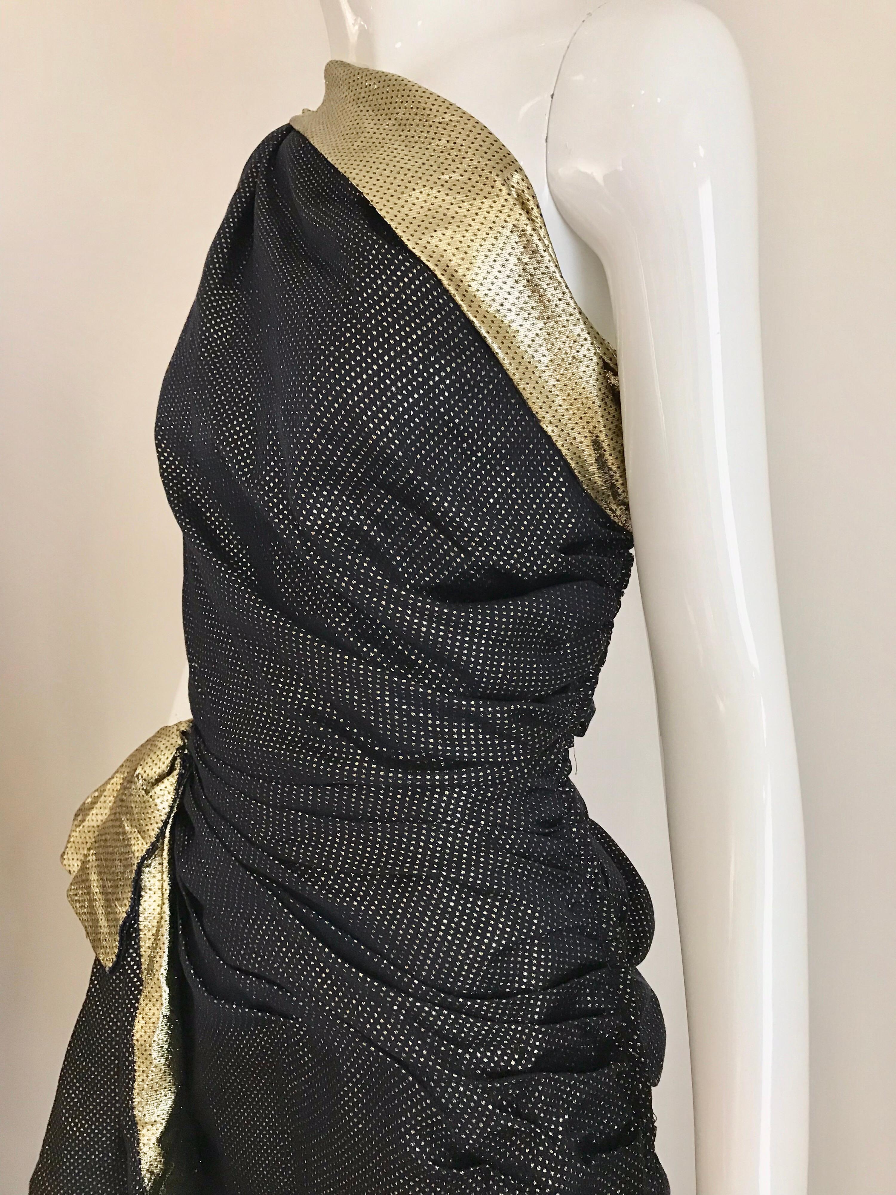 Elegant Vintage Vicky Tiel navy blue and gold silk lamé one shoulder gown. Zips on the side with 8” side slit. 
Measurement: 
Bust: 36 inches / Waist: 28 inches/ Hip: 34 inches/ Dress length: 59 inches